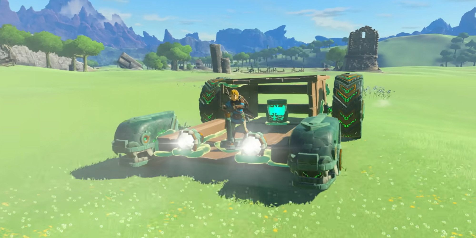 Link riding a large vehicle across some grassy plains in Tears of the Kingdom.