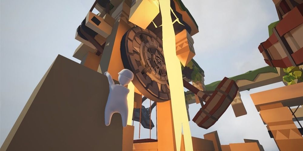 Human Fall Flat screenshot of white humanoid hanging off a ledge.