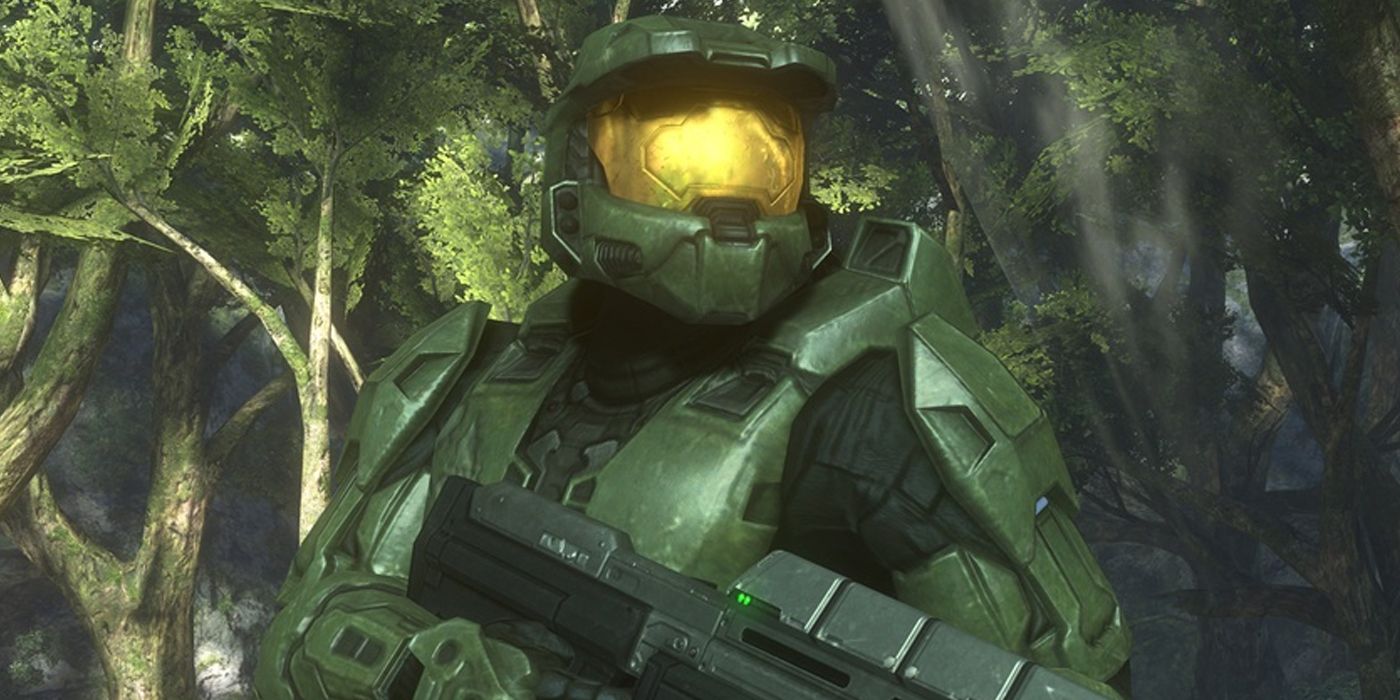 Halo 3 screenshot of Master Chief holding assault rifle in forest.