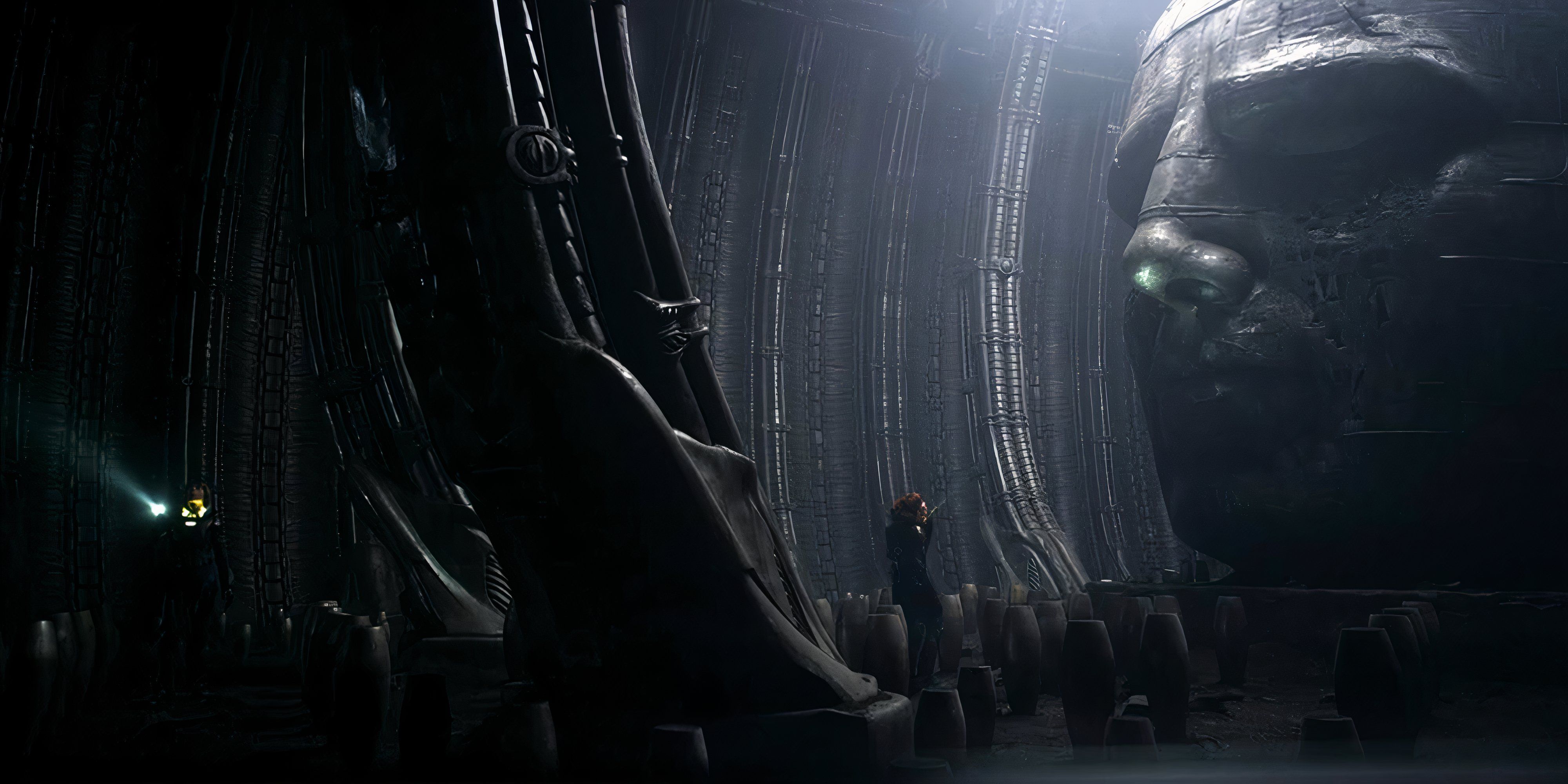 Every Alien Movie, Ranked A Large dark room with a huge statue face