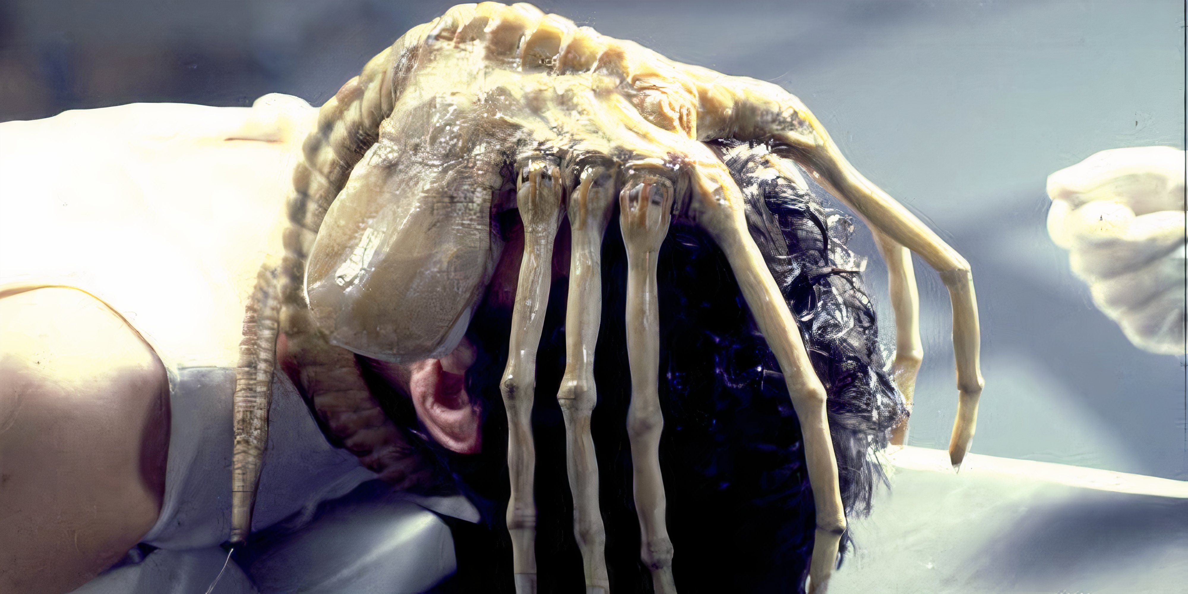 Every Alien Movie, Ranked Cain is on a table with a facehugger over his face