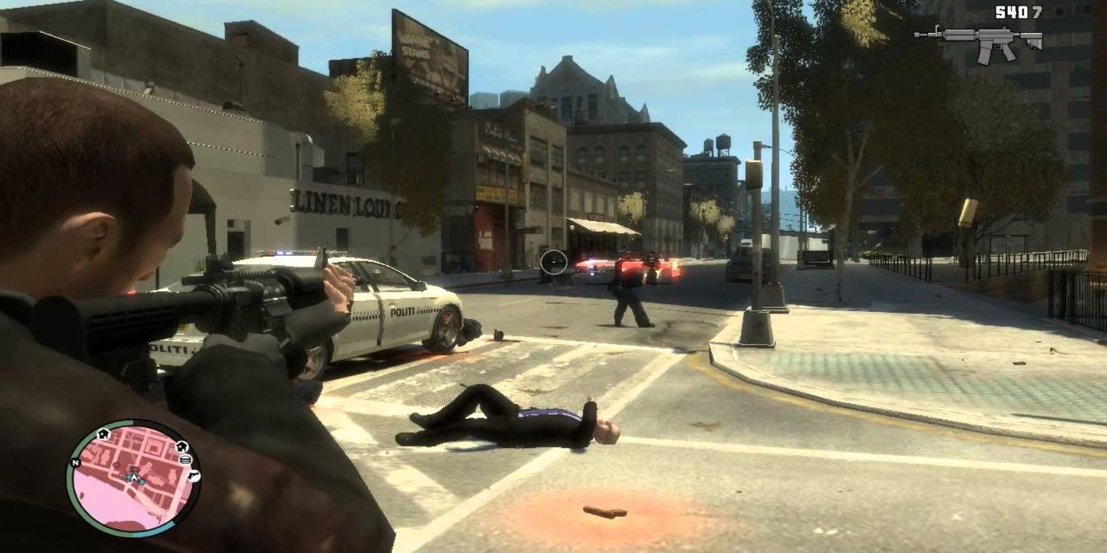 Nico shooting at police officers with an assault rifle in Grand Theft Auto 4