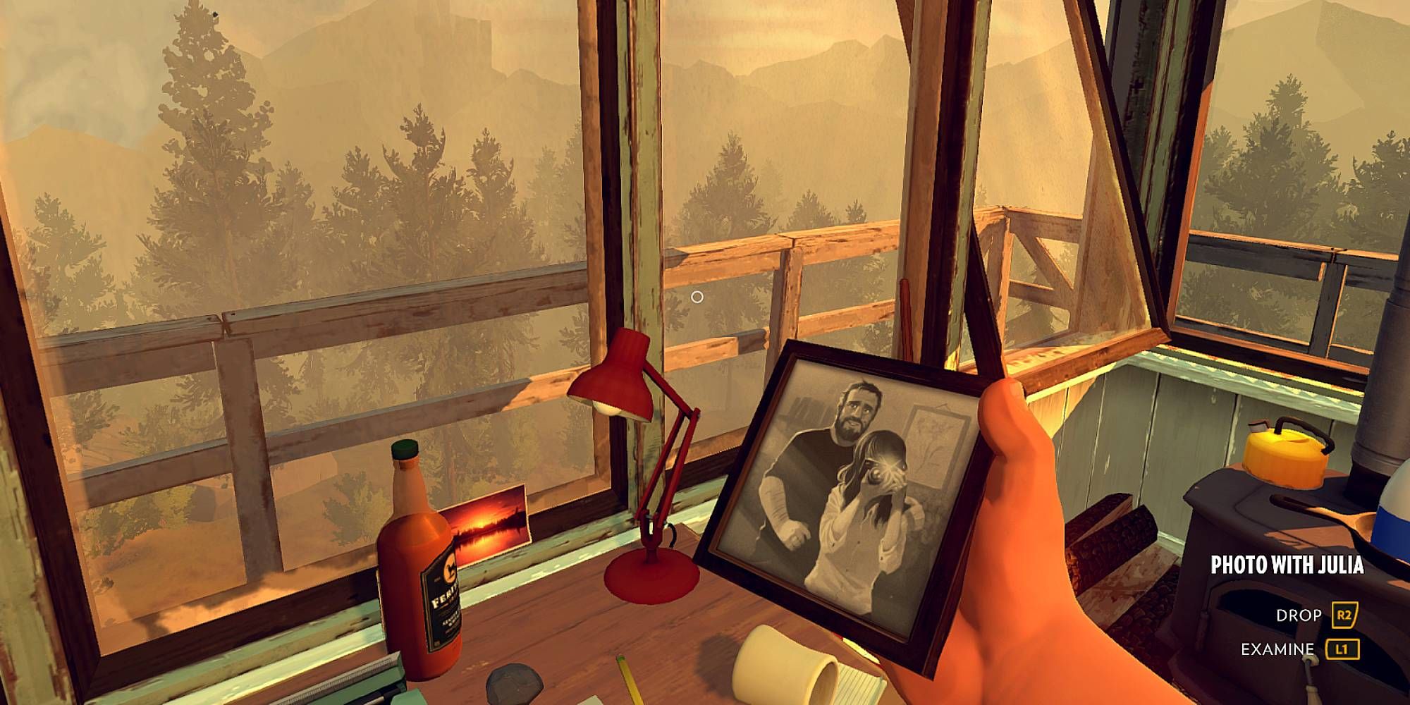 The player holds a picture of a man and a woman in Firewatch.