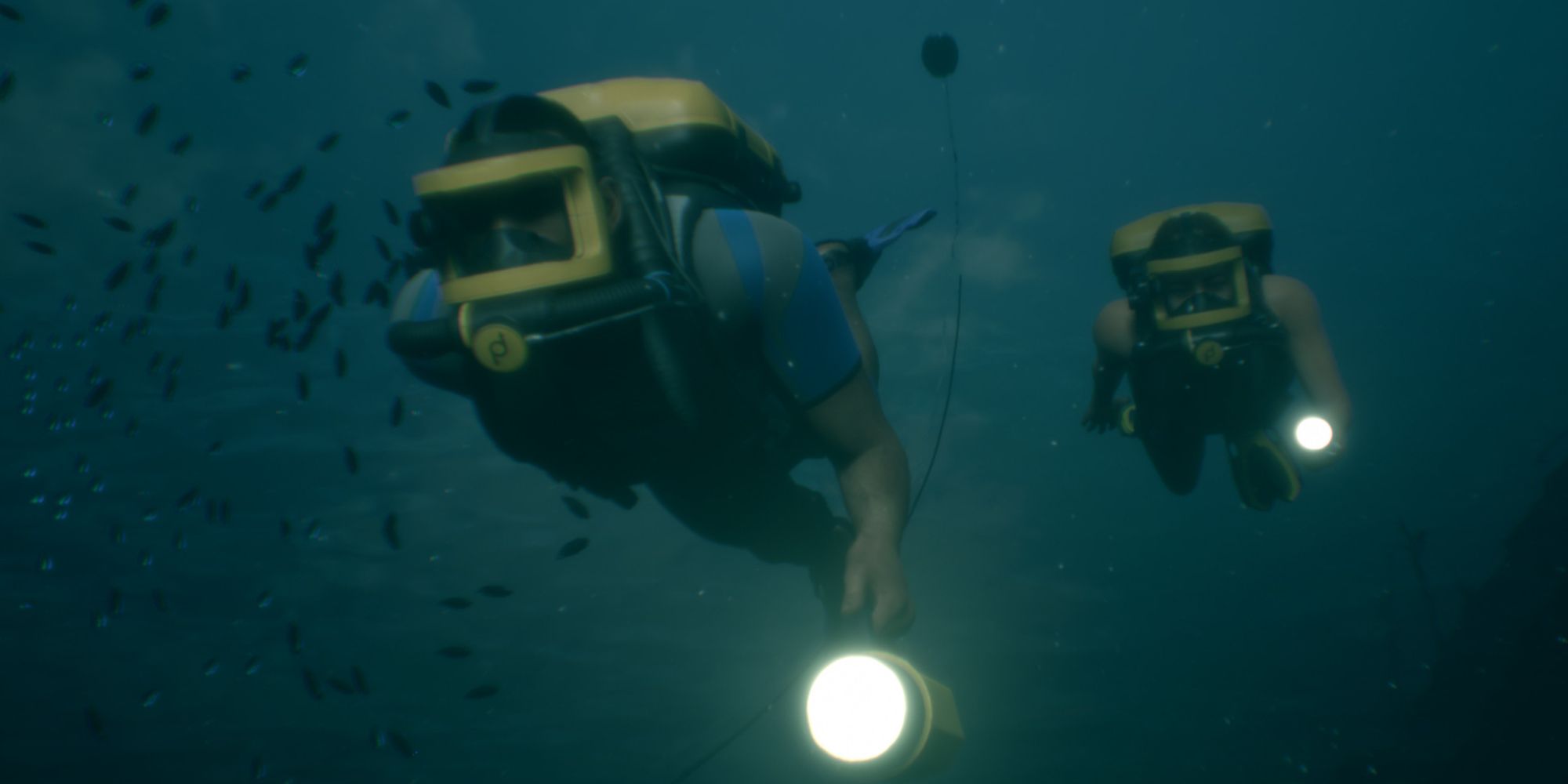 Man of Medan screenshot of two characters swimming underwater.