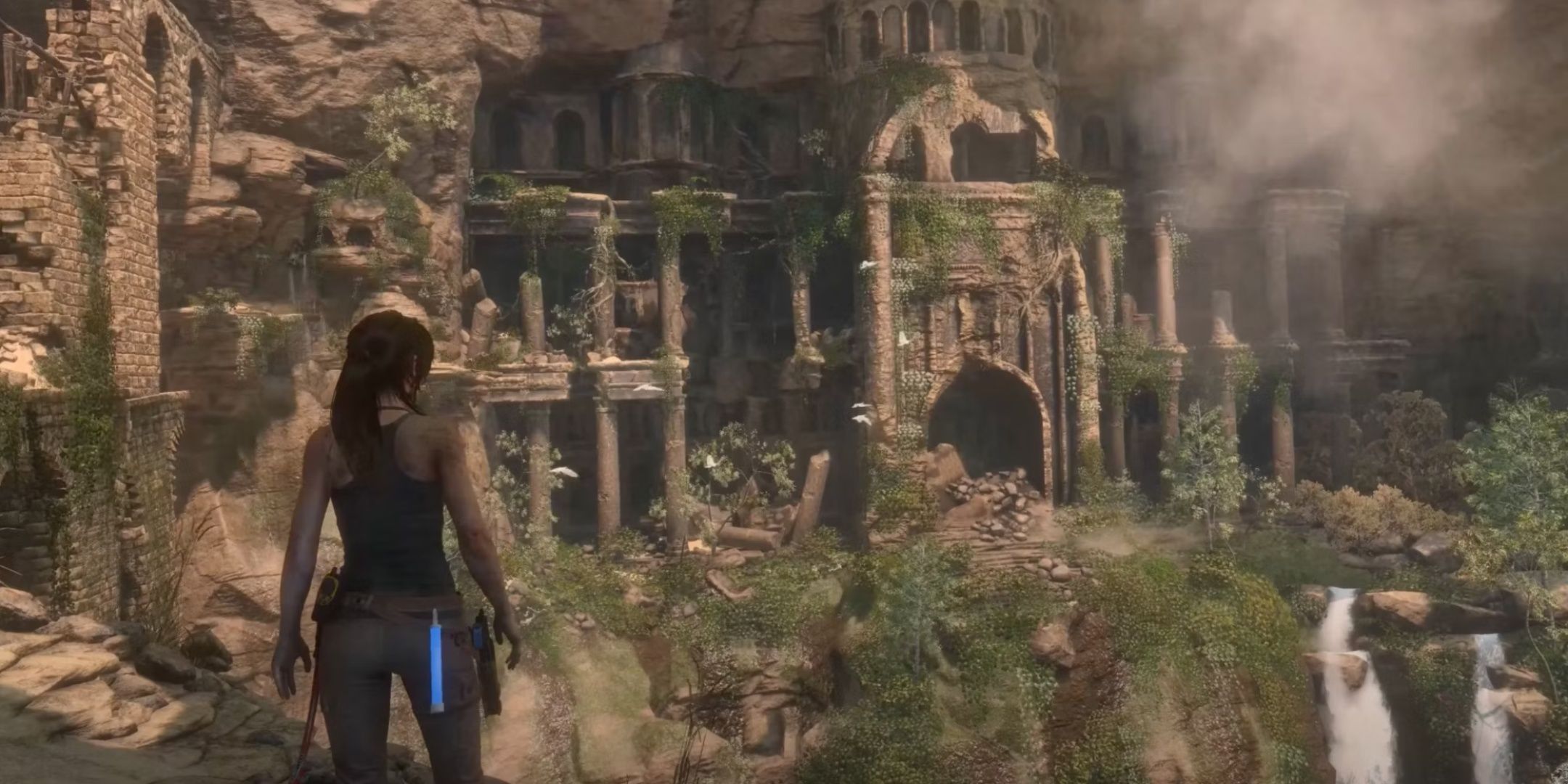 Lara Croft uncovering ruins in Syria in Rise of the Tomb Raider.