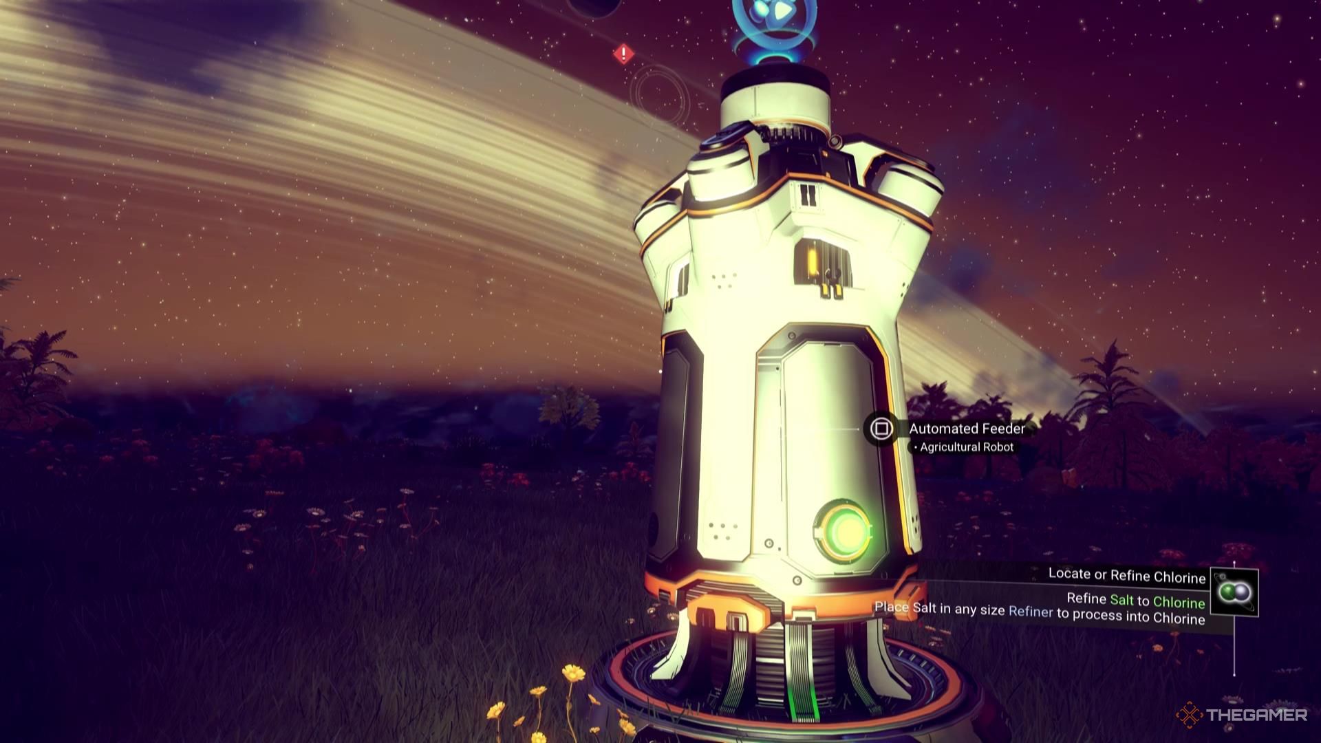 An Automated Feeder sits illuminated by a flashlight against the ringed night sky in No Man's Sky.