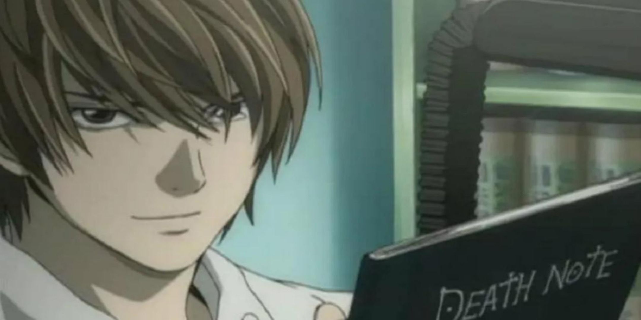 Light Yagami holding the Death Note.