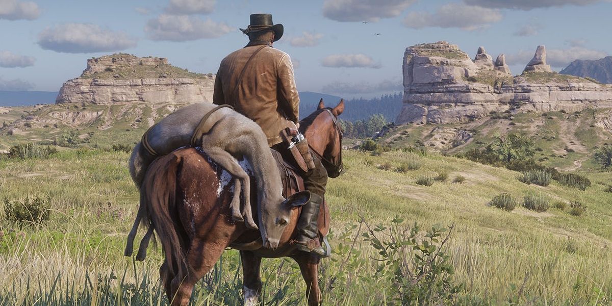 Player resting on a horse looking out at the horizon in RDR2.