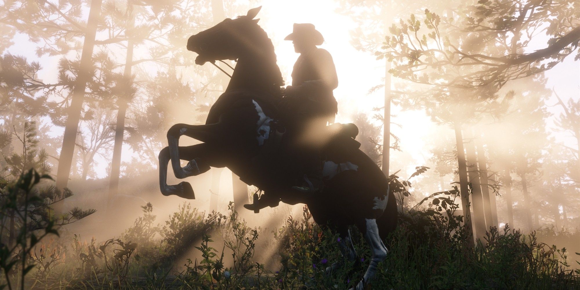 Arthur on a rearing horse, silhouetted by rays of sunlight in Red Dead Redemption 2.