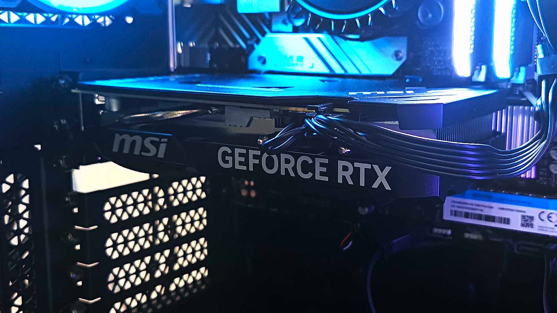 Closeup of MSI RTX 4060 GPU inside case with power connected