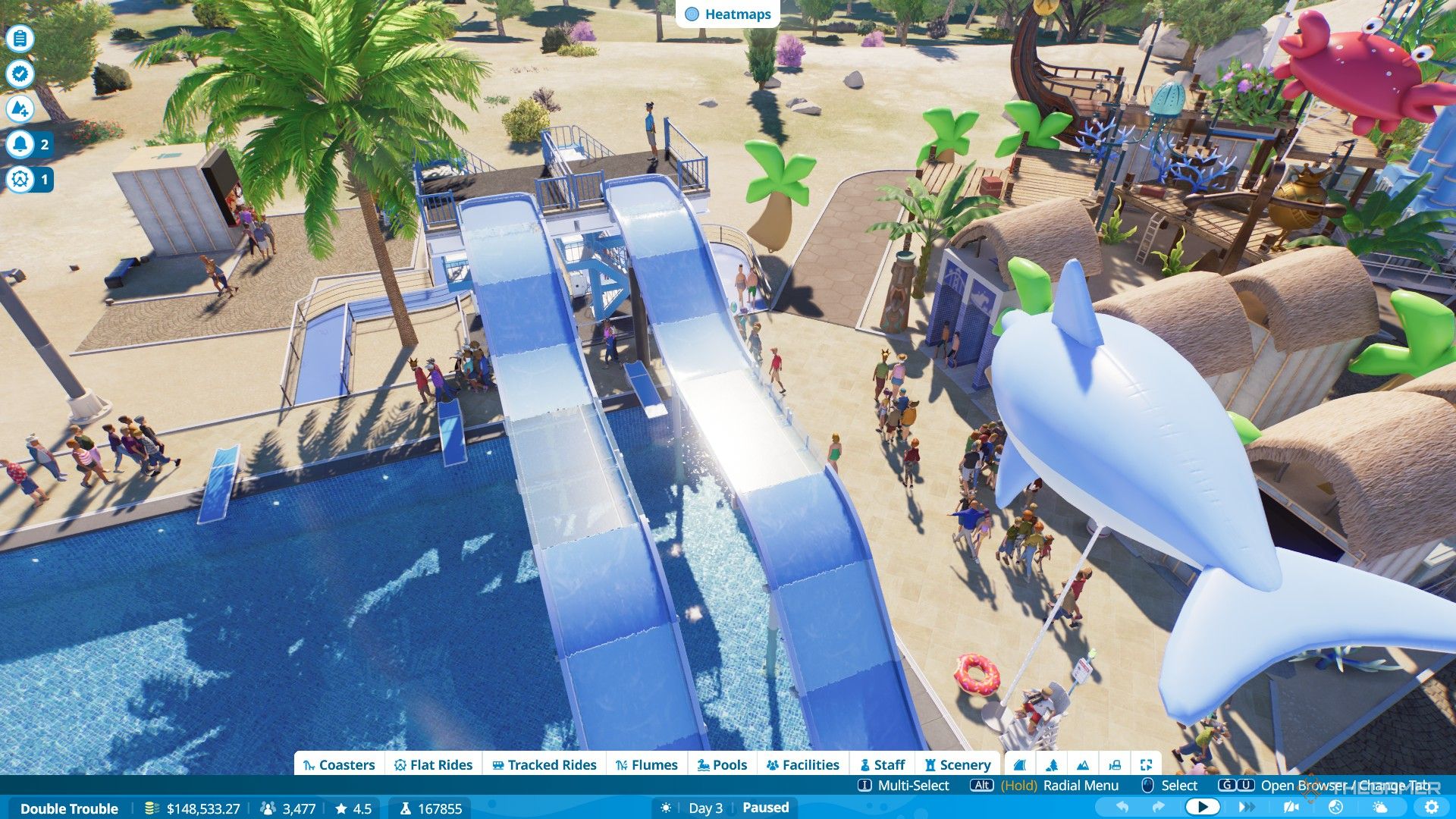 The player builds two flumes to complete bronze objectives for Double Trouble level in Planet Coaster 2.