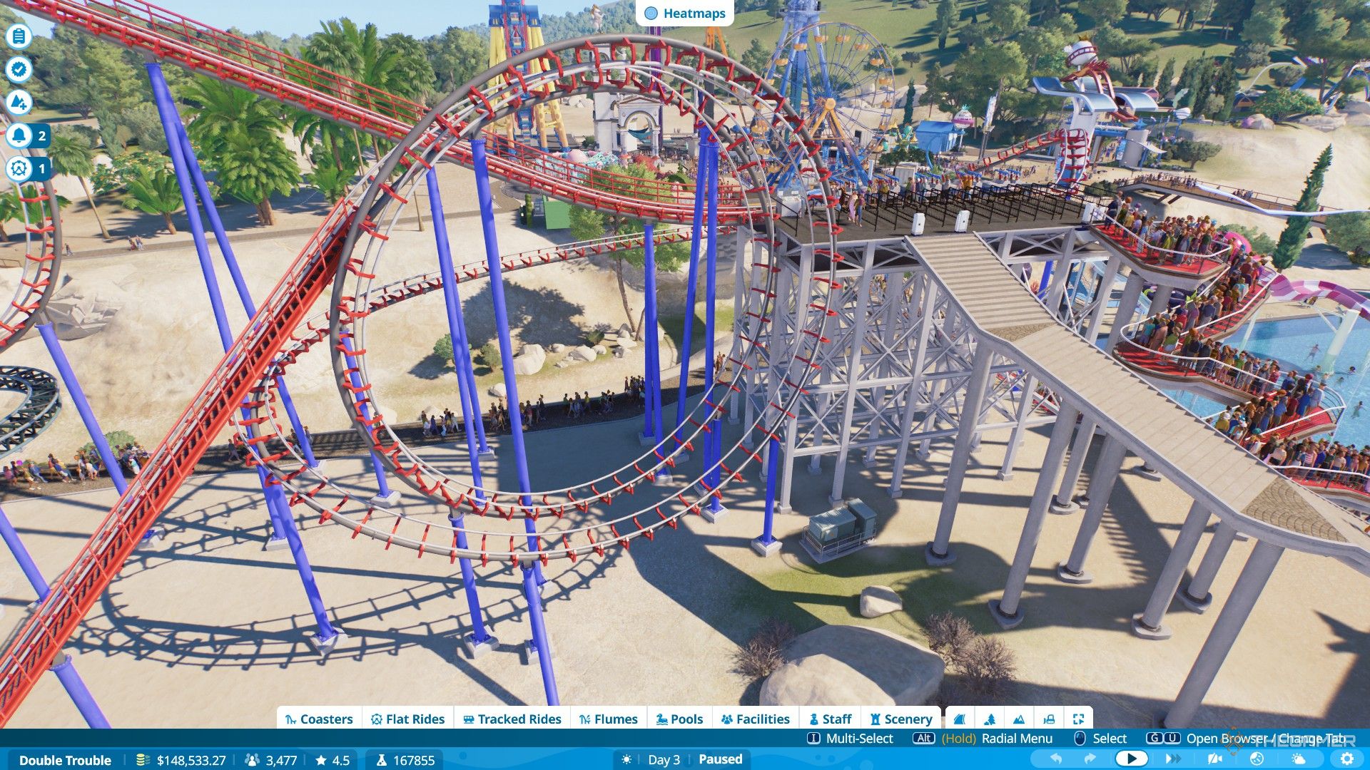 The player builds a custom coaster with an inversion in Planet Coaster 2.