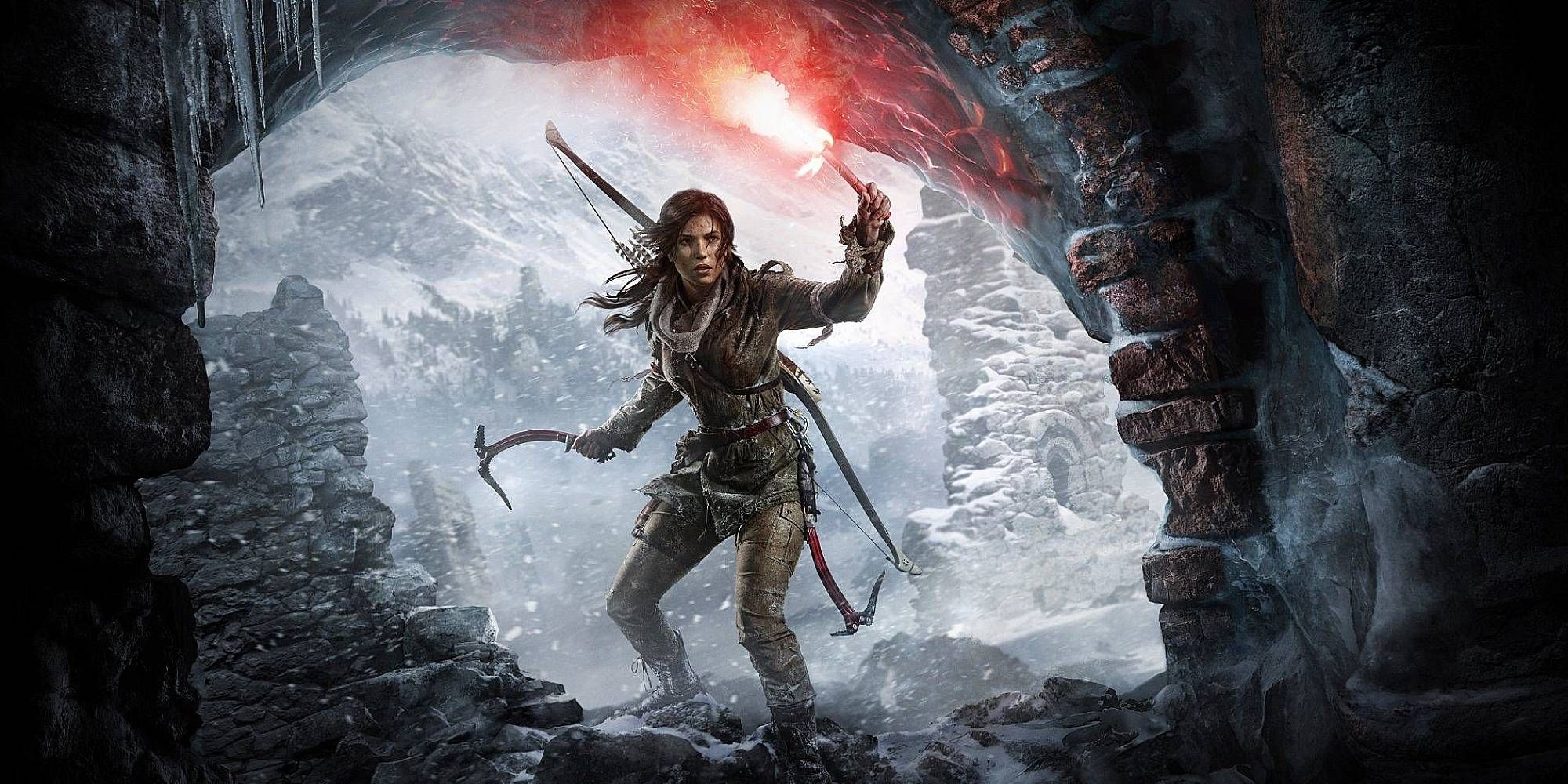 A brunette woman stands holding a flare in an icy cave