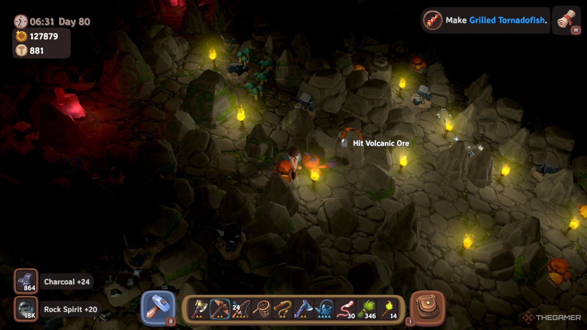 Player character mining Volcanic Ore while inside the Forbidden Jungle Cave in Luma Island.