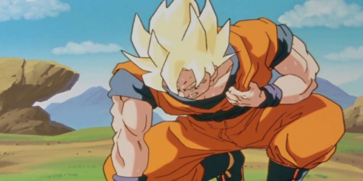 Dragon Ball Z screenshot of Goku crouched down holding his heart.