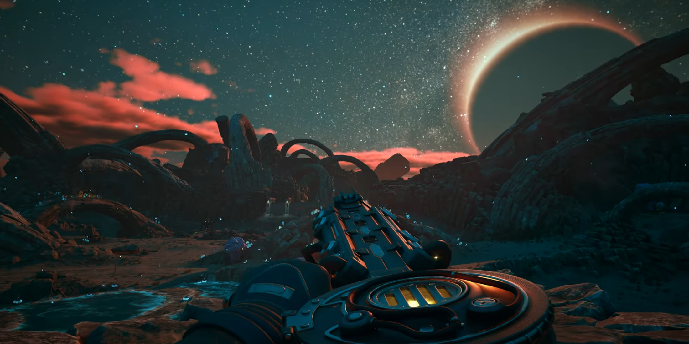 Vast alien landscape under a starry sky in The Outer Worlds 2