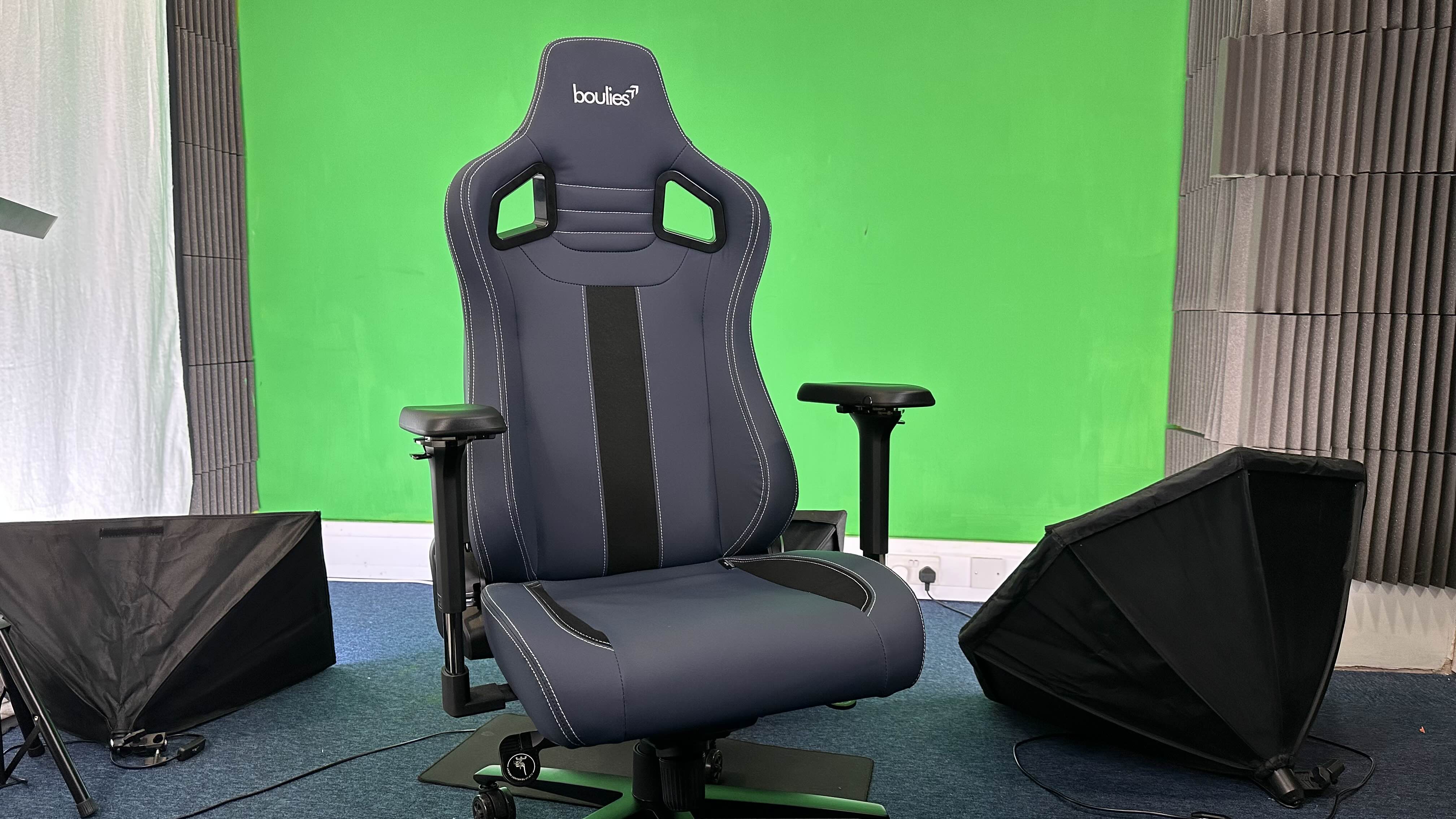 A Boulies Elite Series gaming chair in front of a studio background