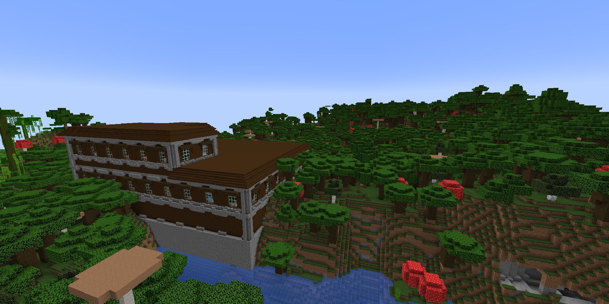 A woodland mansion in dark forest biome of minecraft from above.