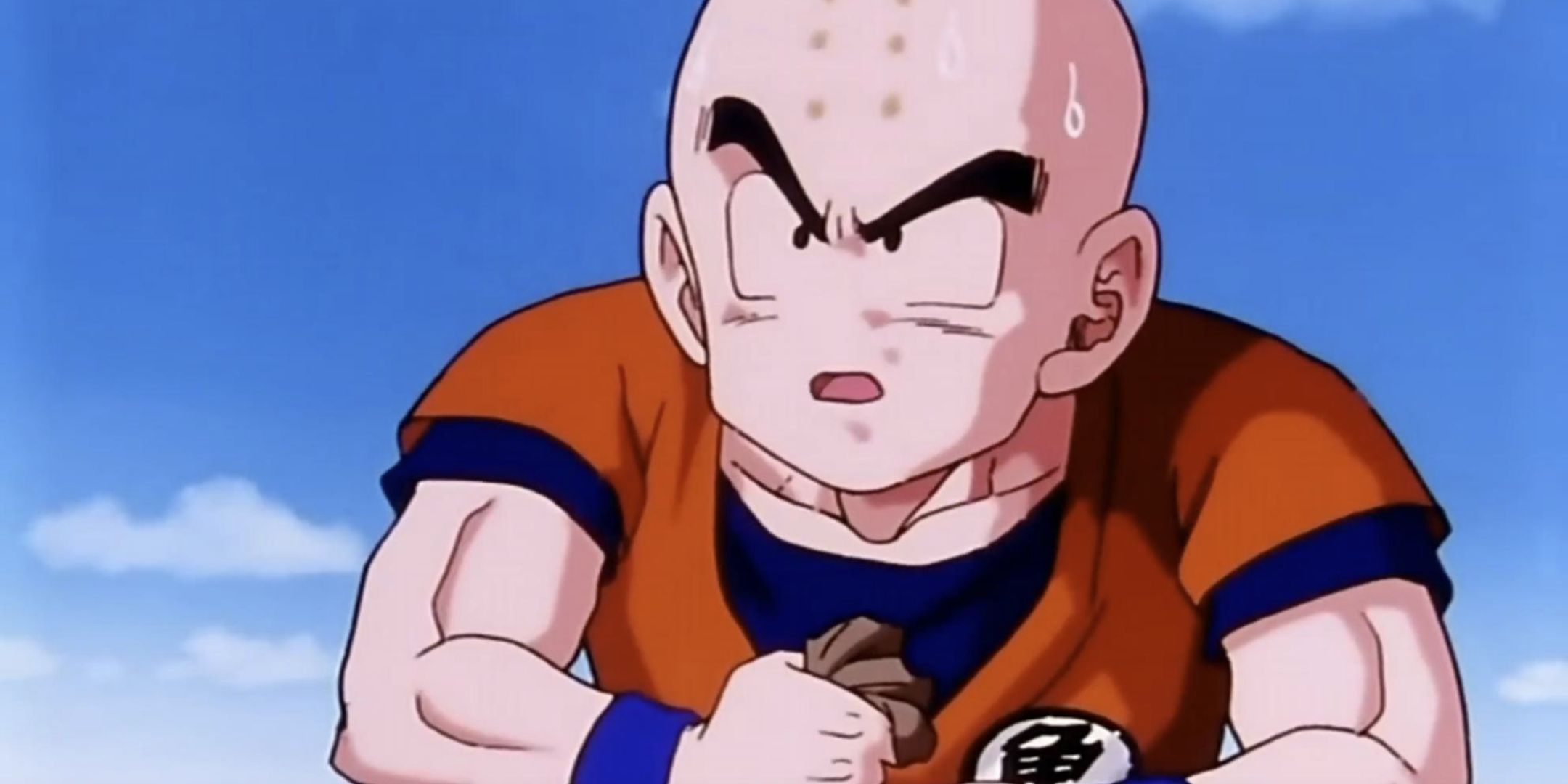 Krillin holding Senzu Beans in Dragon Ball Z.