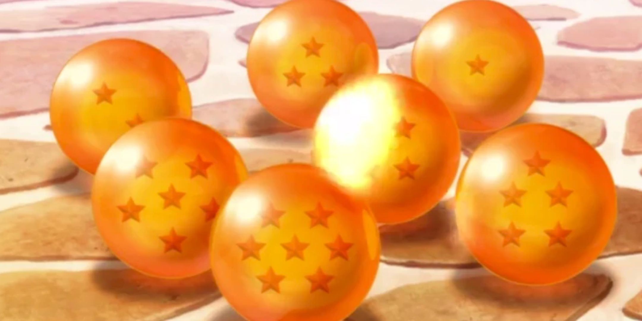 The seven dragon balls, orange spheres with the shape of stars inside them.