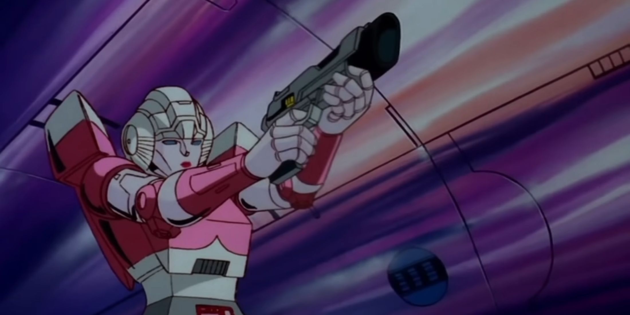 Arcee from The Transformers (1986) using a gun