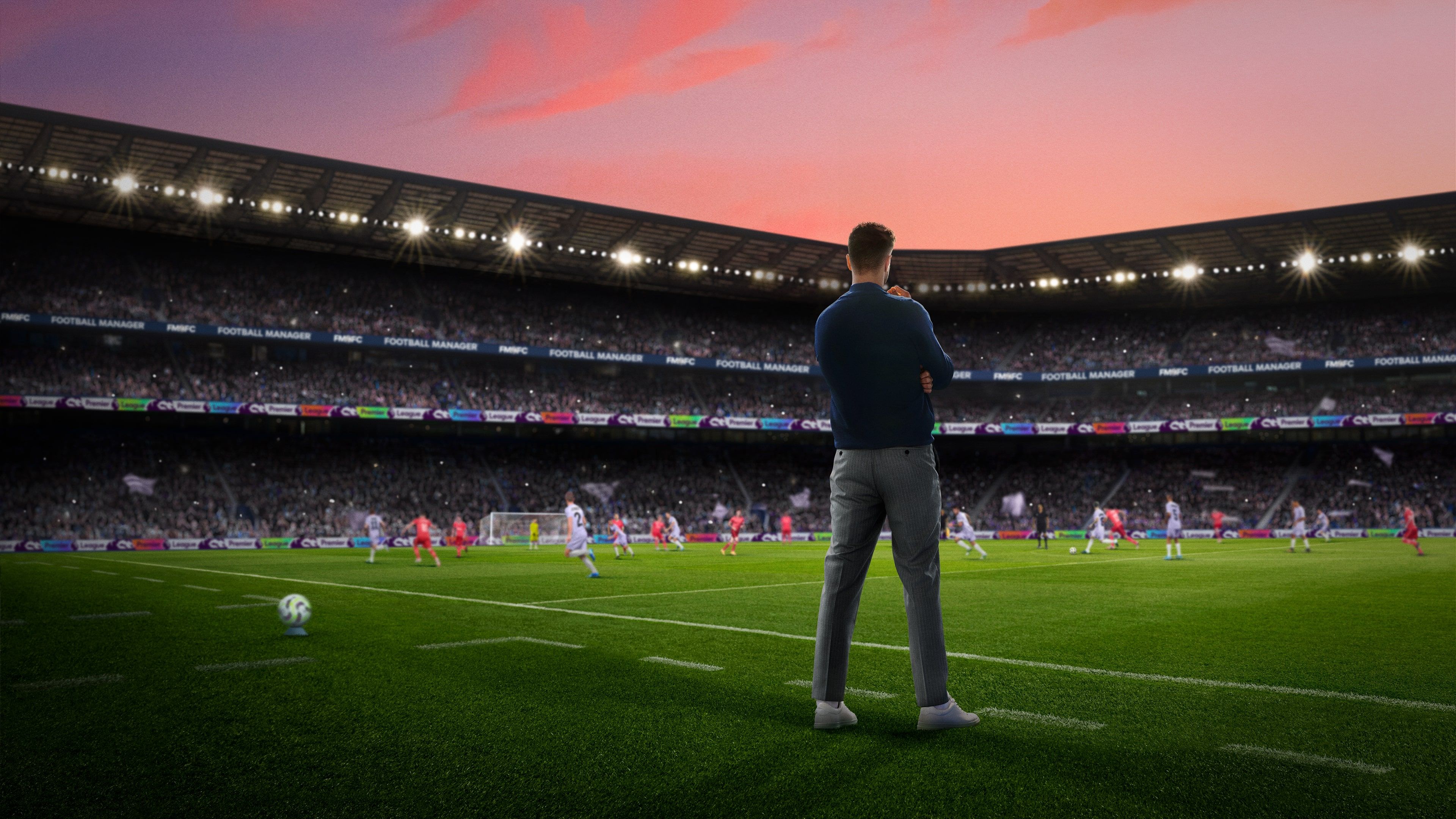 Manager standing on the sideline, looking at the pitch.