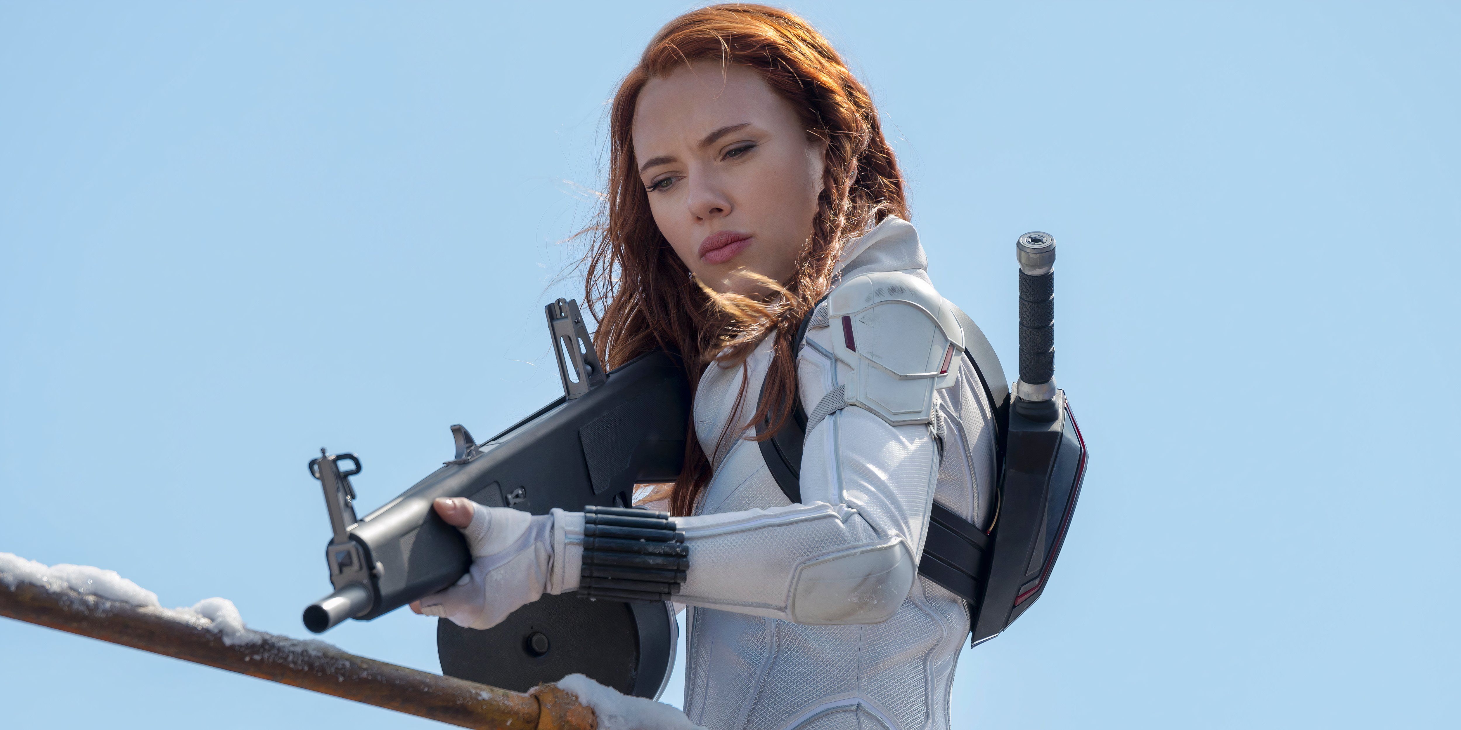 Black Widow points a gun 