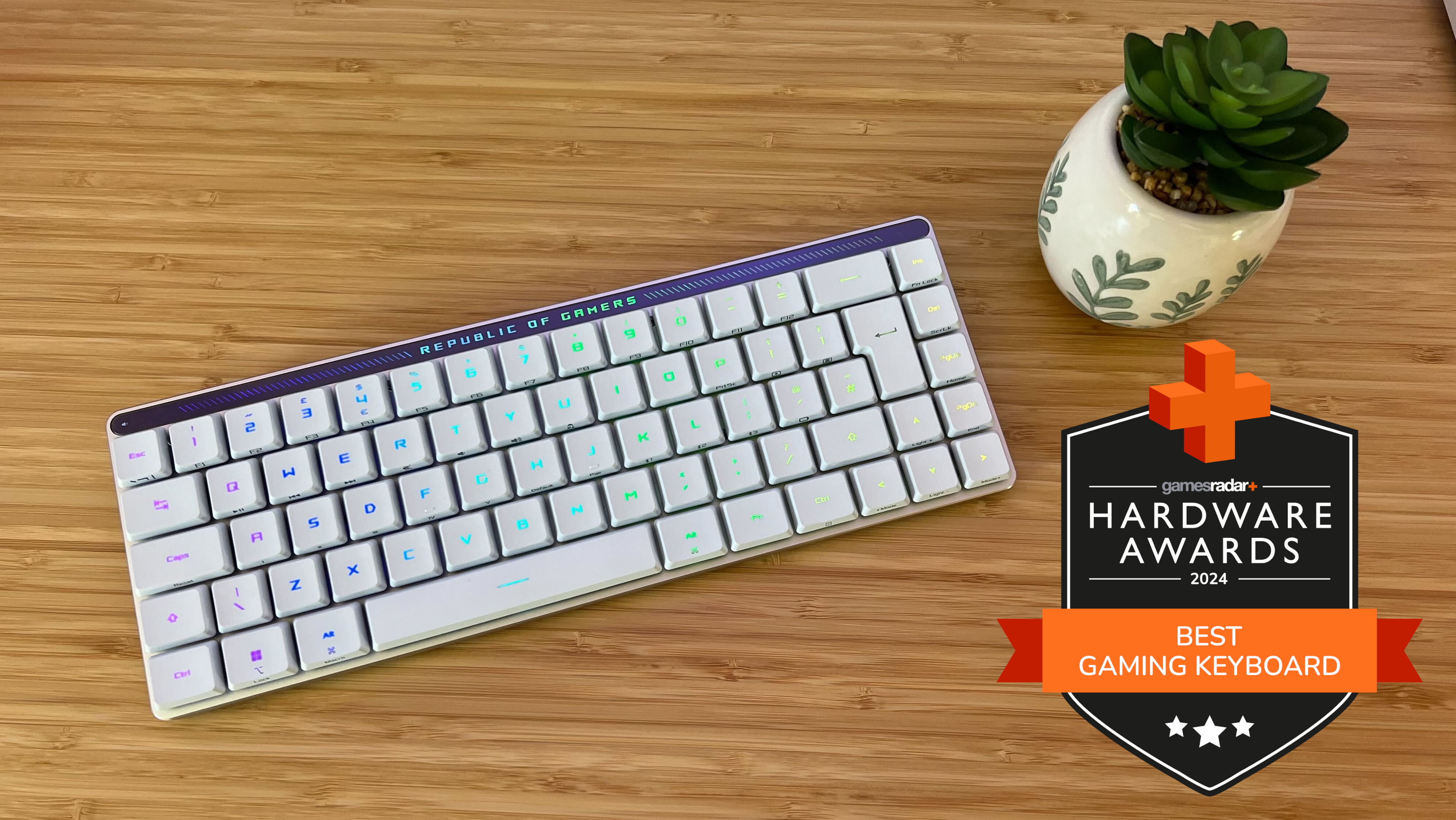 Asus ROG Falchion RX Low Profile gaming keyboard on a wooden desk with GamesRadar+ Hardware Awards badge