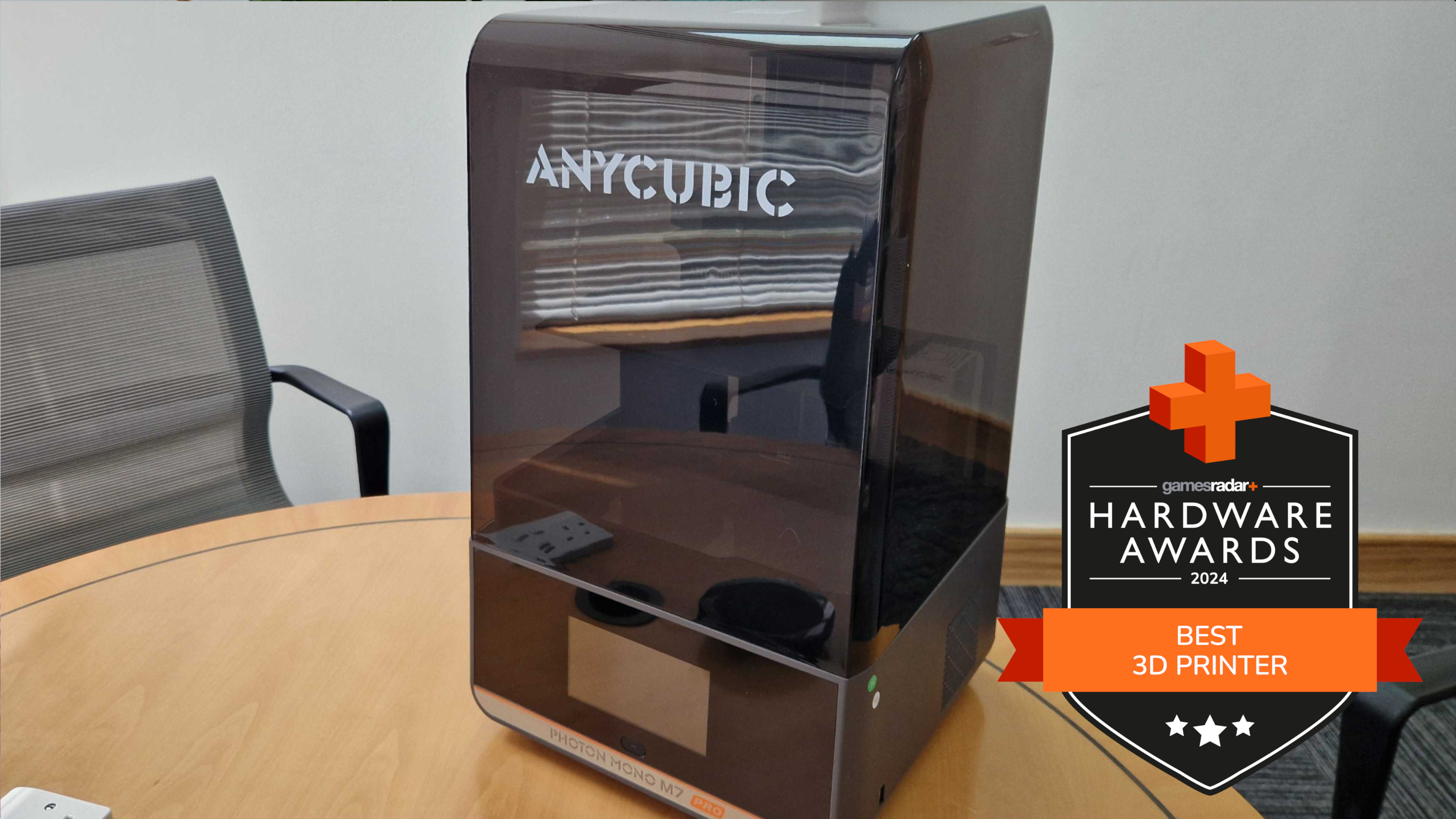 Anycubic Photon Mono M7 Pro 3d printer on a table with GamesRadar+ Hardware Awards badge