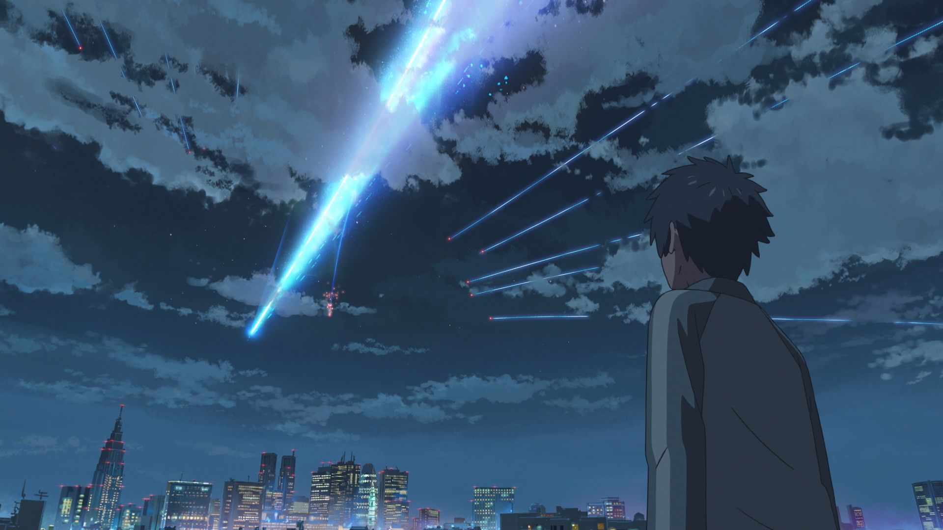 Taki watching a comet streak over the sky in Tokyo during Your Name