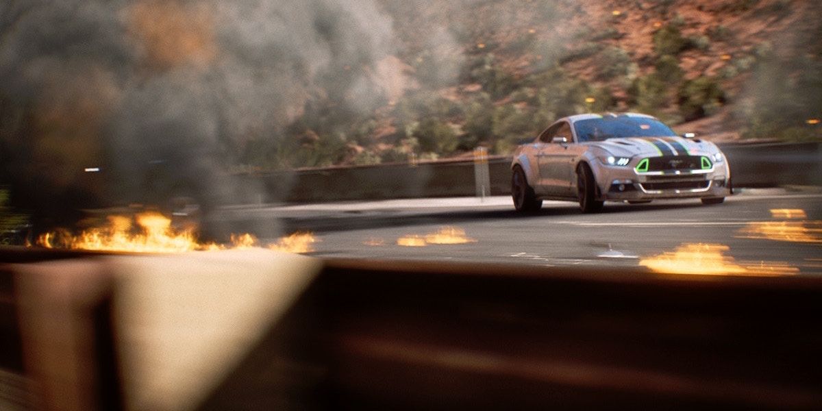 Need For Speed Payback cinematic with a car rounding the corner near fire.