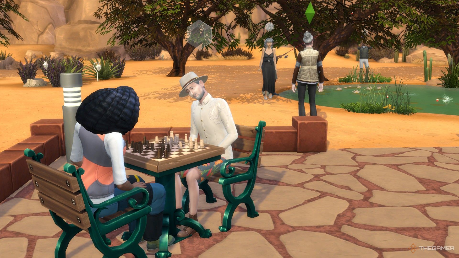 Sims playing chess and fishing at the park in Oasis Springs in The Sims 4.