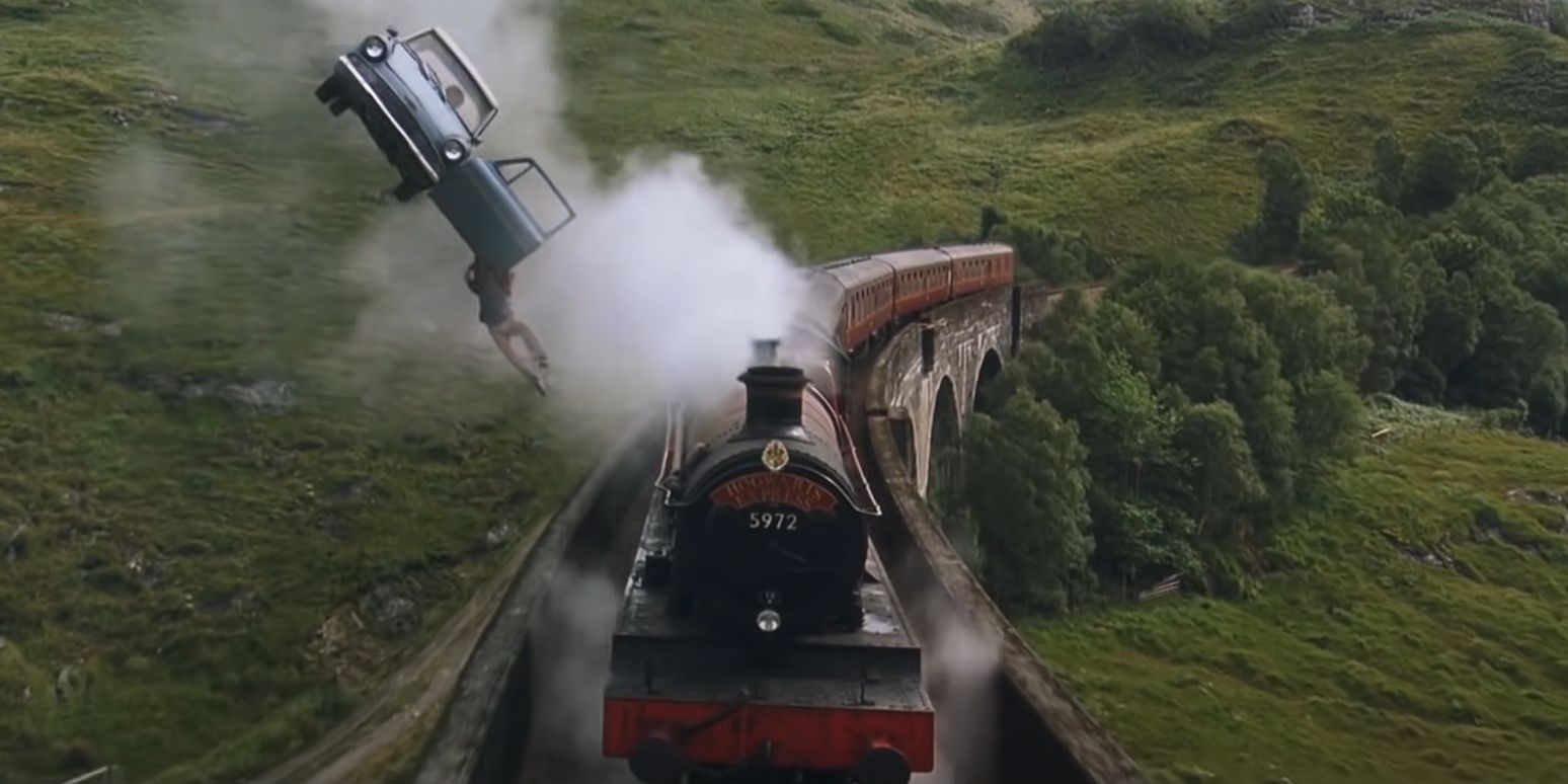 Harry Potter hangs onto Ron's flying car, next to the Hogwarts Express on the Glenfinnan Viaduct