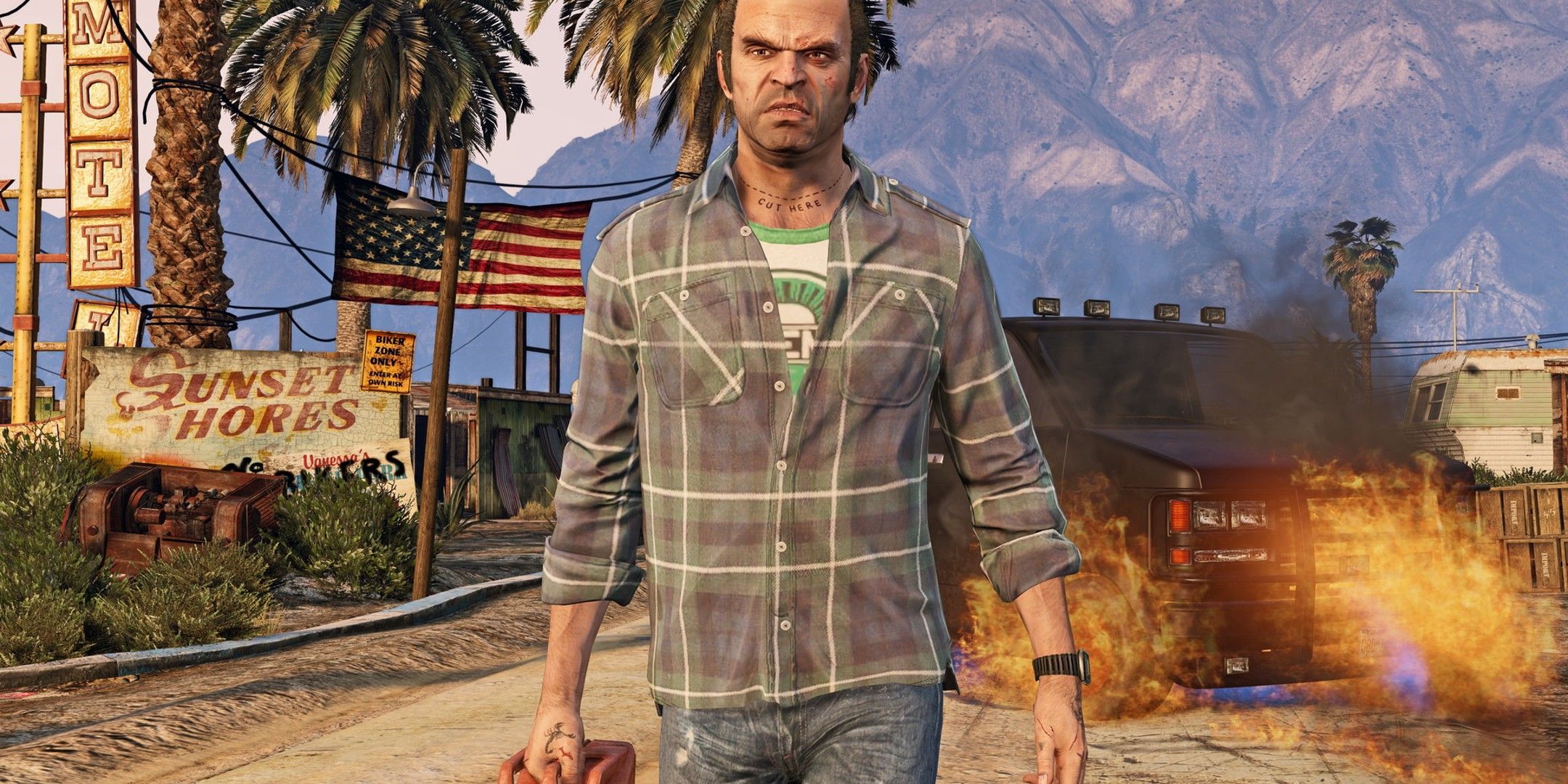 Trevor walking away from a burning car in Grand Theft Auto 5.