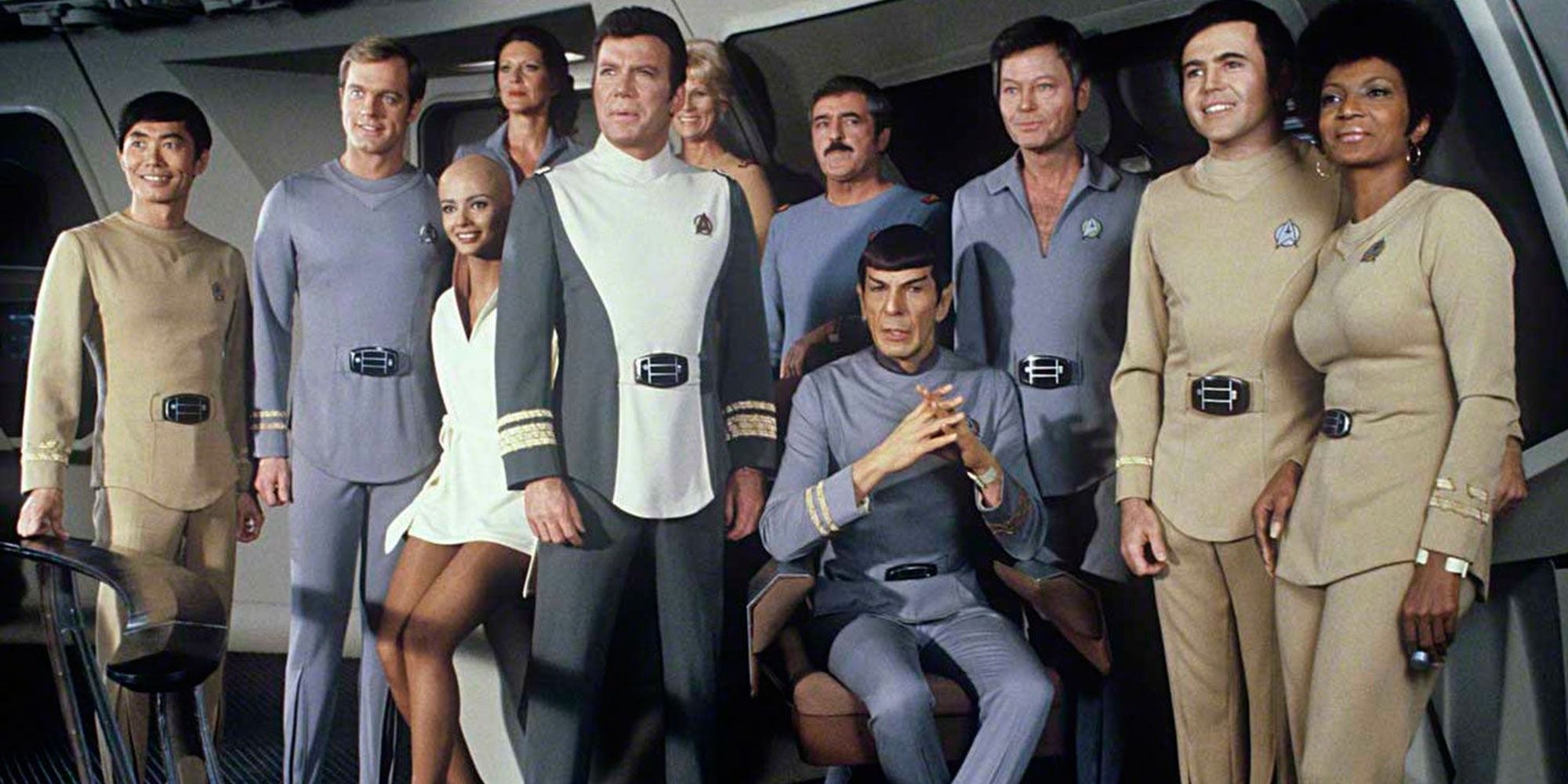 Star Trek: The crew of the Enterprise standing on the bridge.