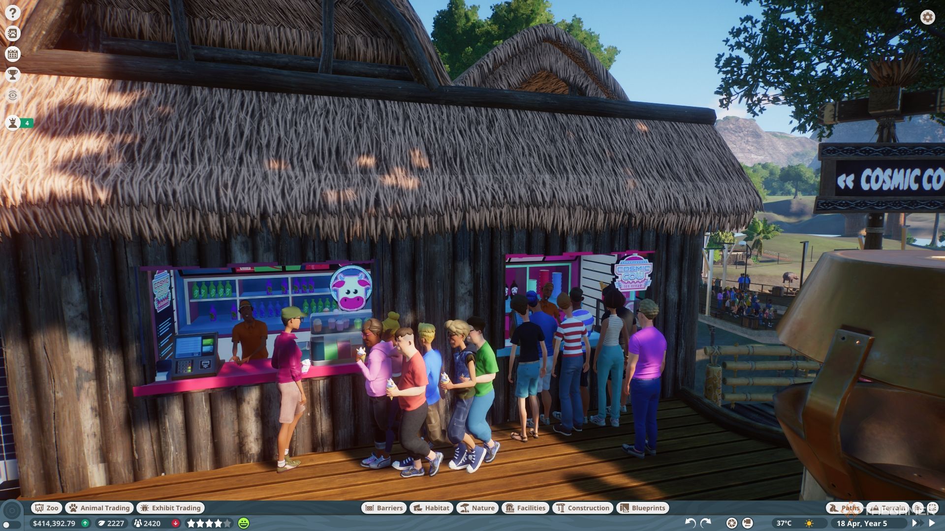 Planet Zoo Guests lined up outside the Cosmic Cow shop.