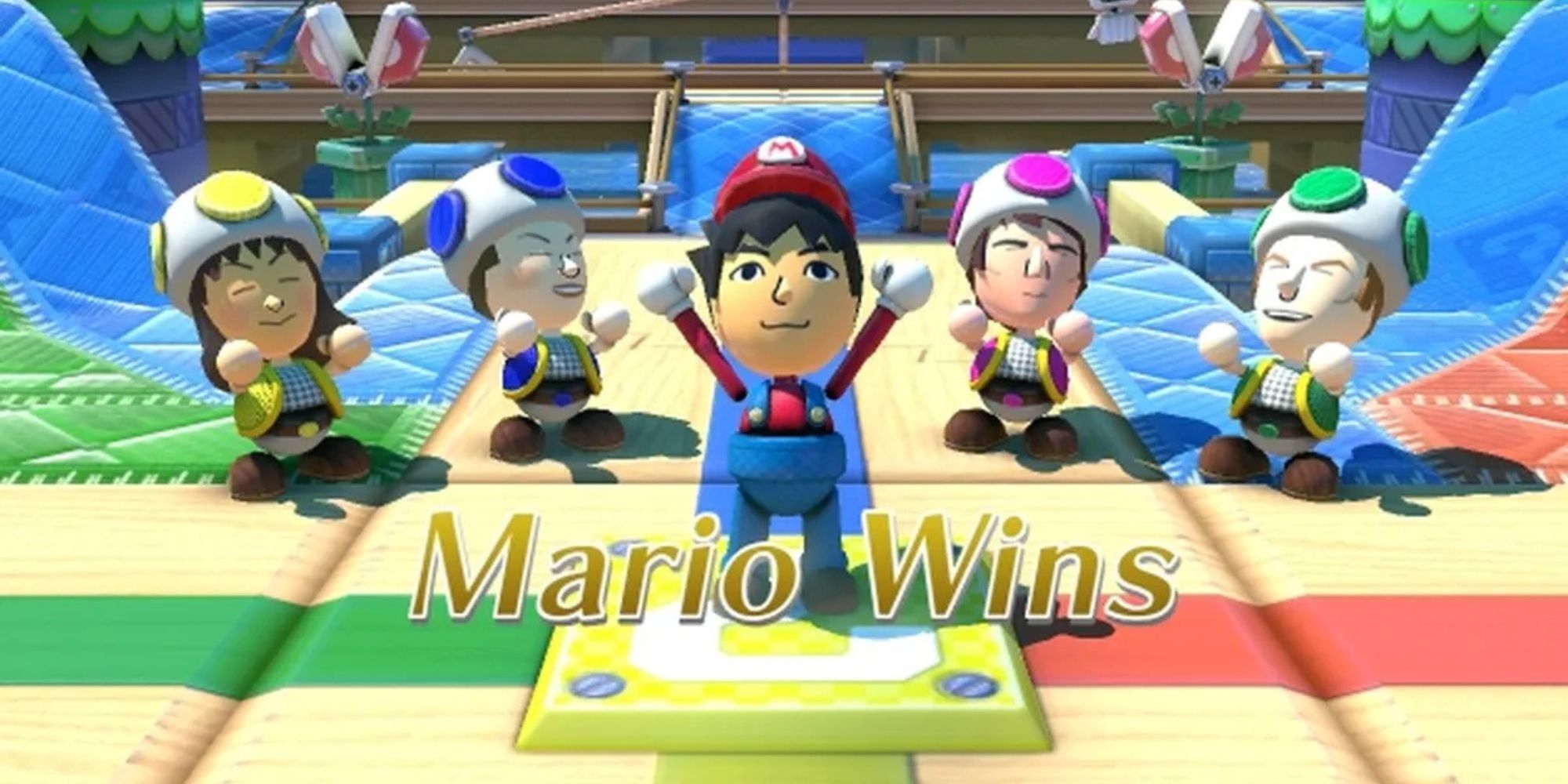 A bunch of characters celebrating Mario's victory in one of the mini games.