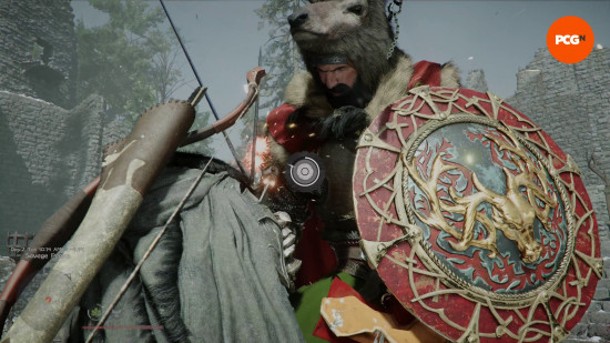 An image of a man wearing a stag-head hat with a huge red and gold shield fighting a man wearing a cloak