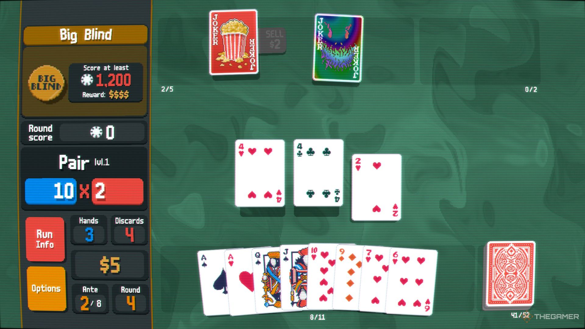 A screenshot from Balatro showing a game in play, with a pair of fours being raised in the middle of the table and a single two laying flat next to it. 