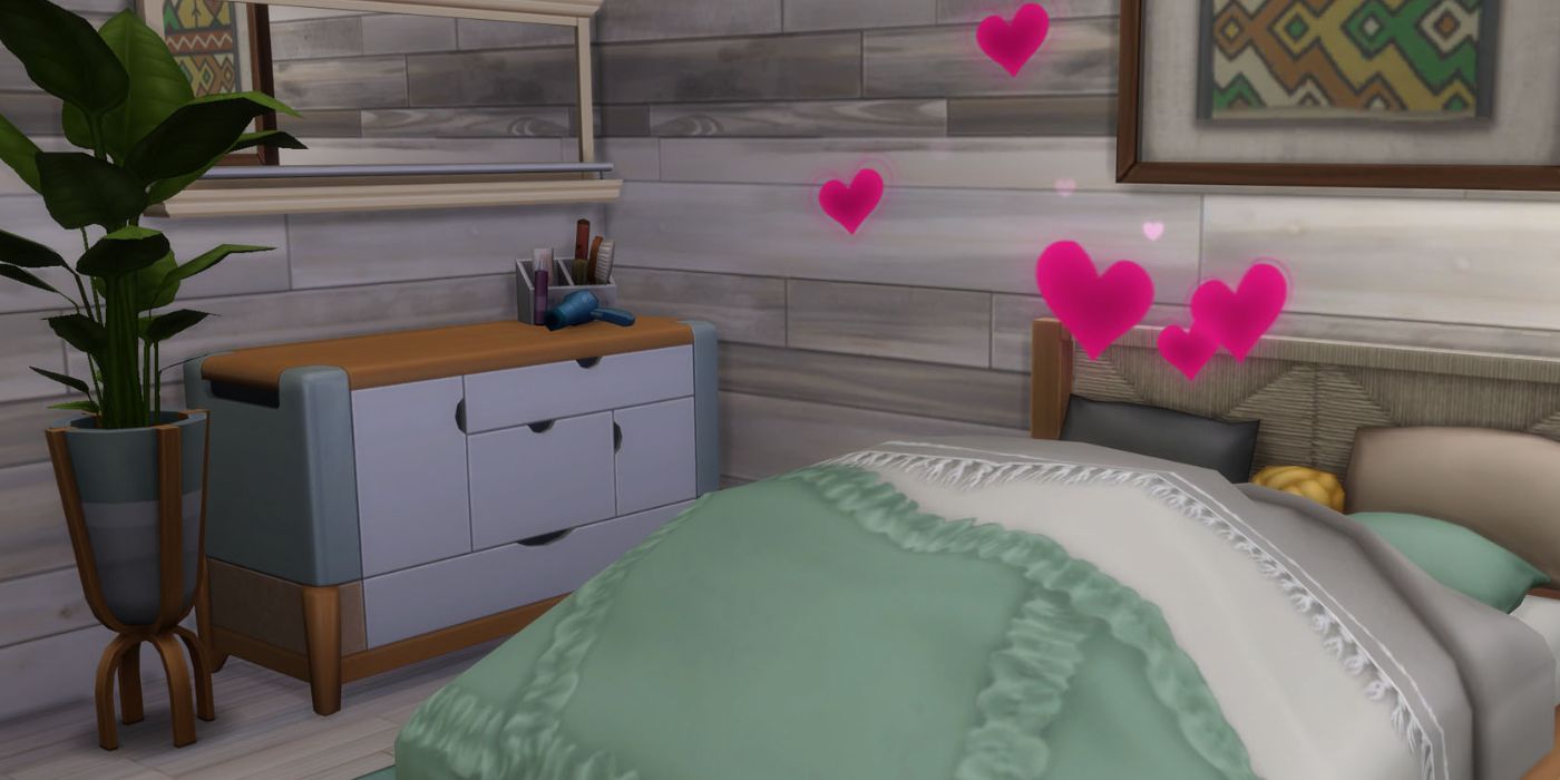 Two sims woohoing in a bed.