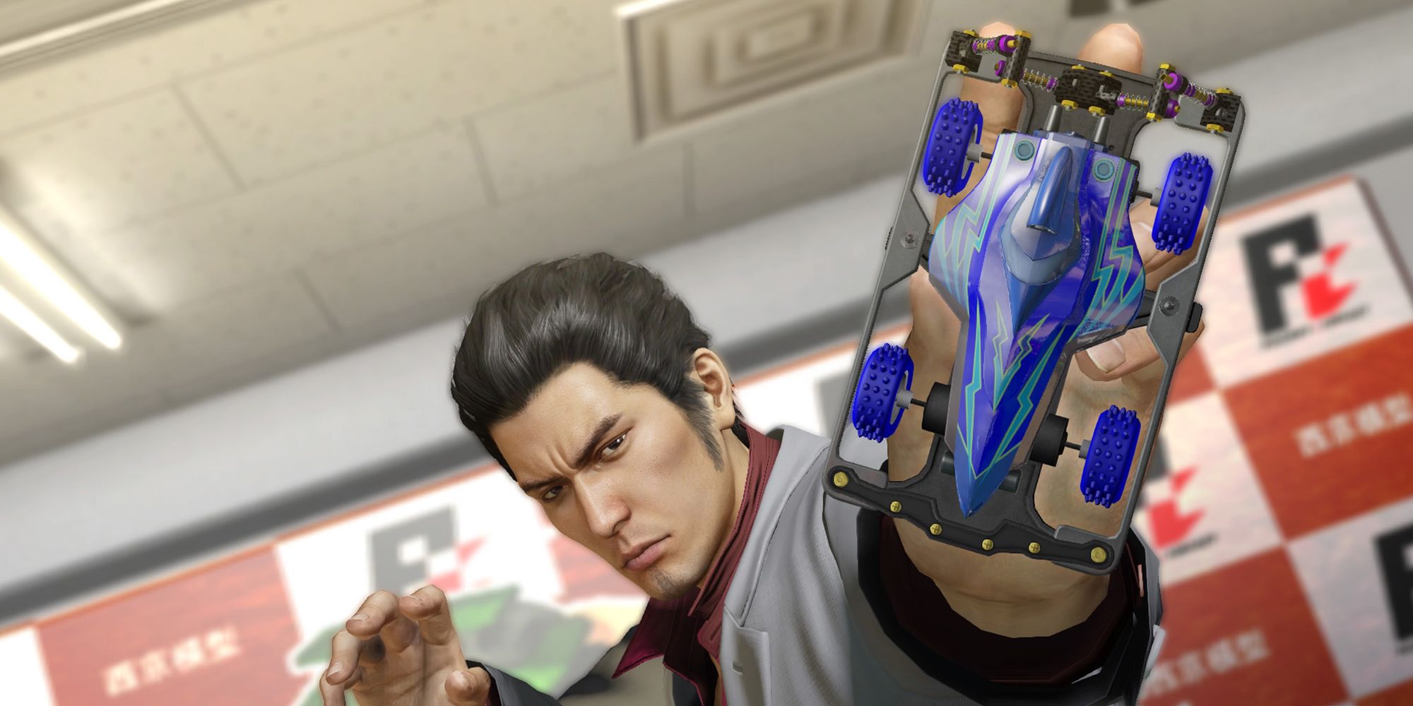 Kiryu holding up a Pocket Circuit Racer car in Yakuza Kiwami.