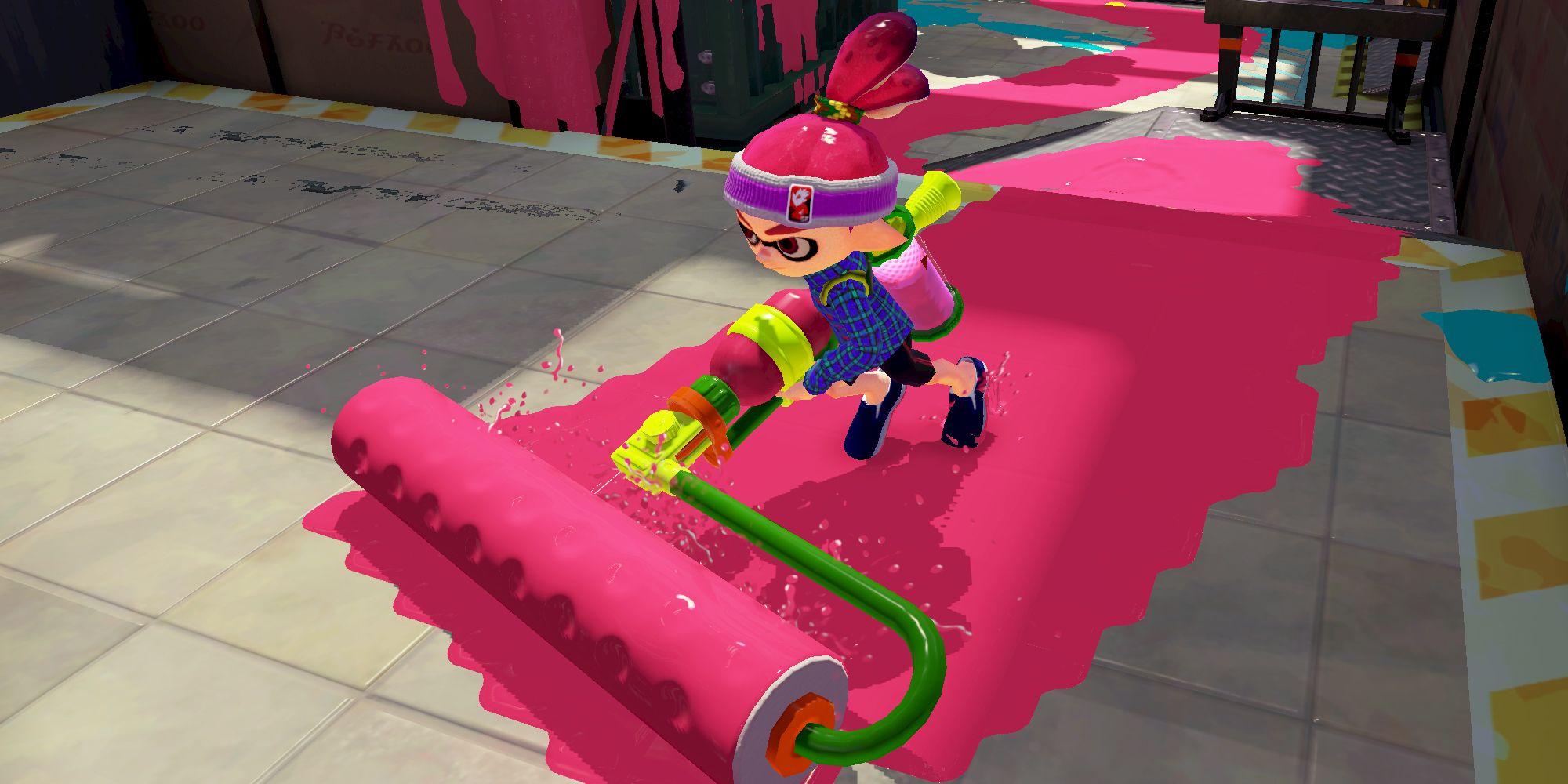 Splatoon 1 character rolling a trail of pink paint with a giant horizontal paint brush attached to a gun.