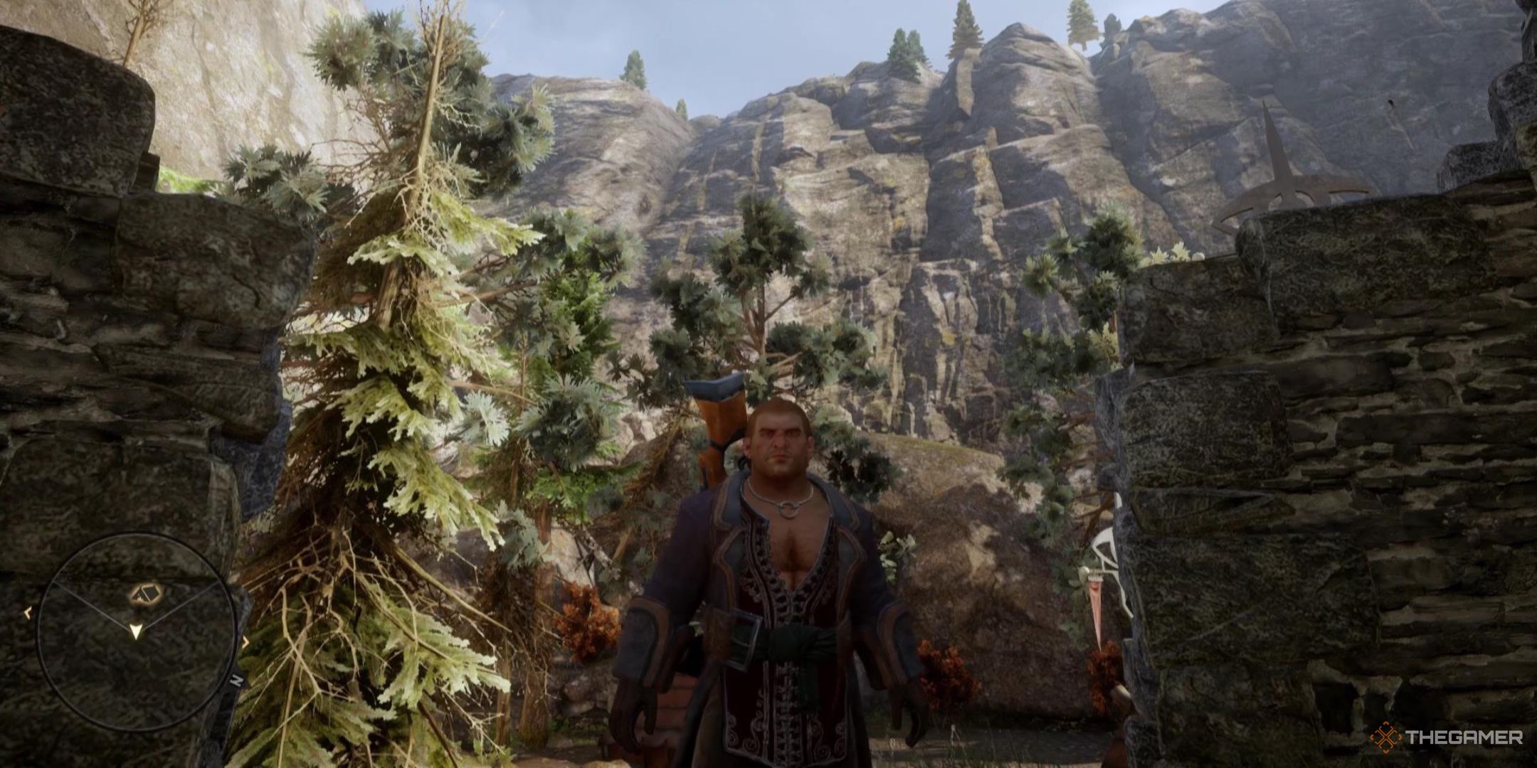 Varric stands in front of a backdrop of mountains in Dragon Age: Inquisition