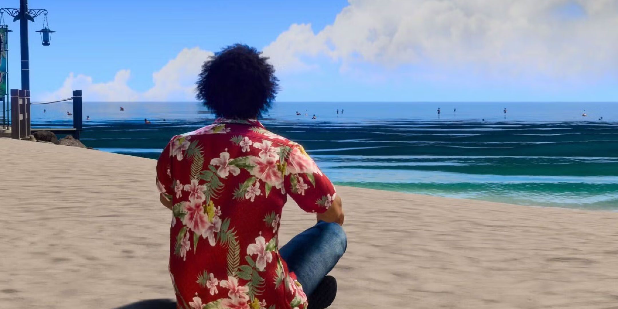 Like a Dragon Infinite Wealth screenshot of Ichiban sitting on a beach in Hawaii.