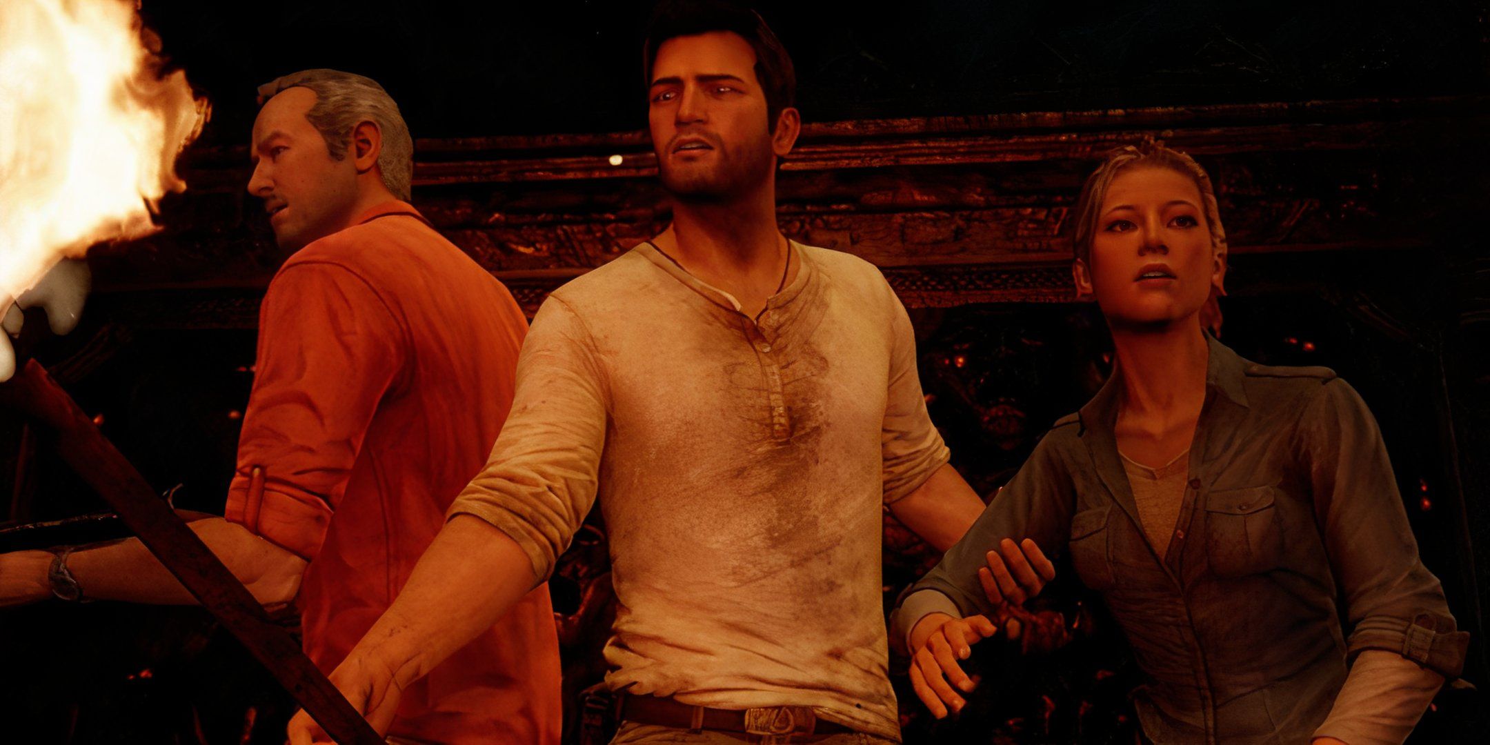 Sully, Nate, and Elena searching a tomb using torchlight in Uncharted 3. 