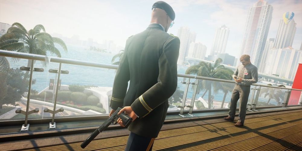 Hitman Agent 47 sneaking in plain sight with a silenced pistol towards the target.