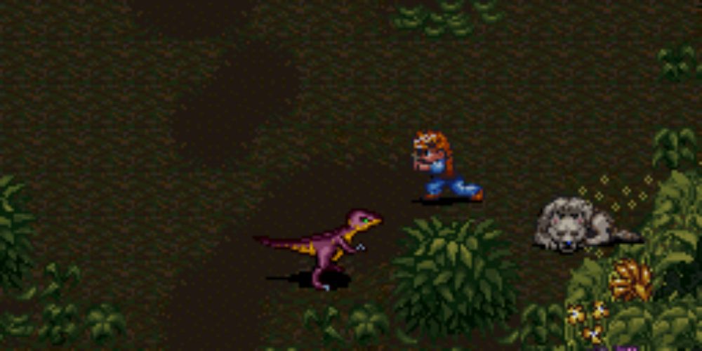 Secret Of Evermore screenshot of character holding a bone facing a dinosaur with a wolf sleeping nearby.