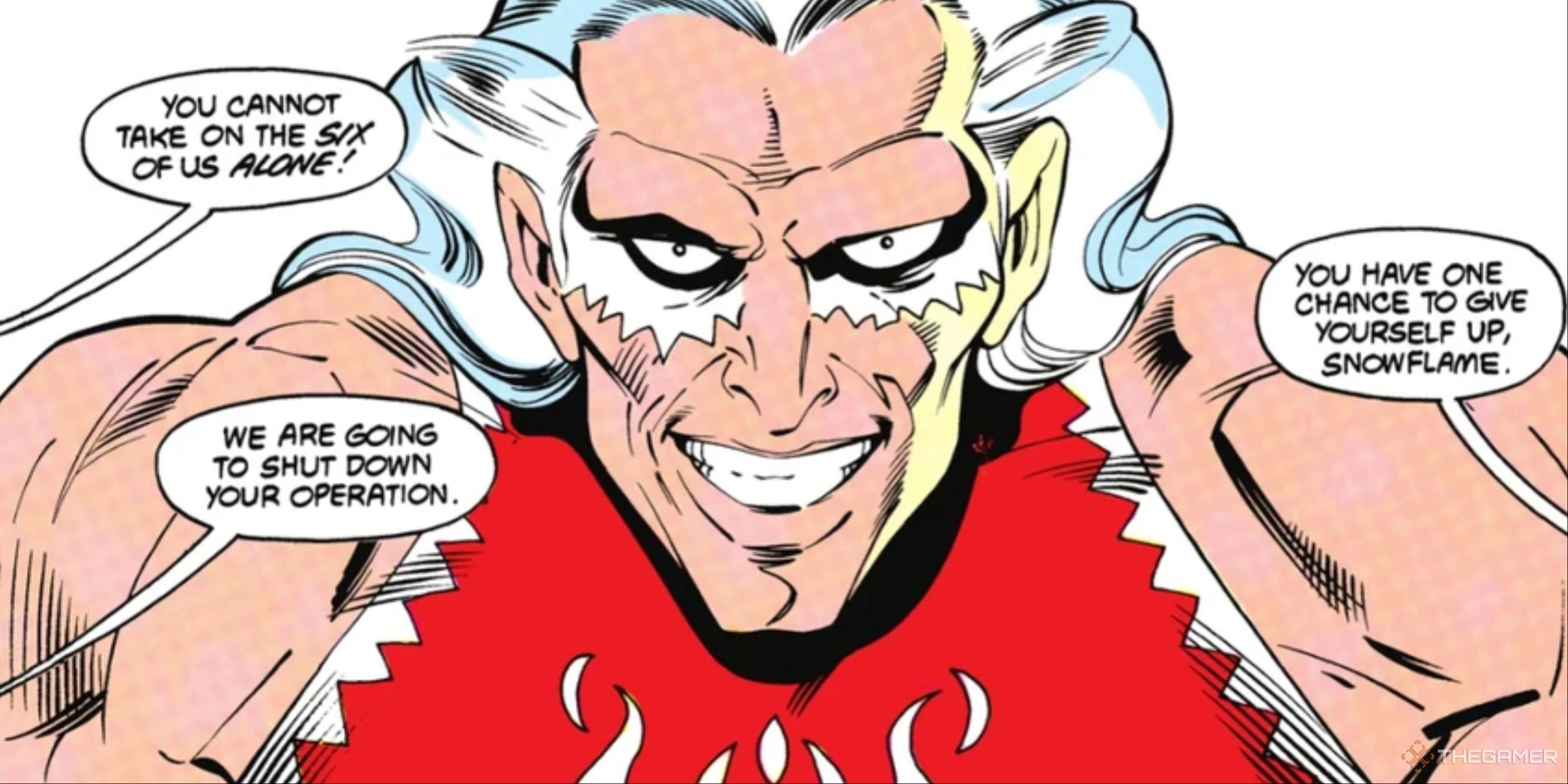 A grinning man with white hair and white makeup under his eyes.