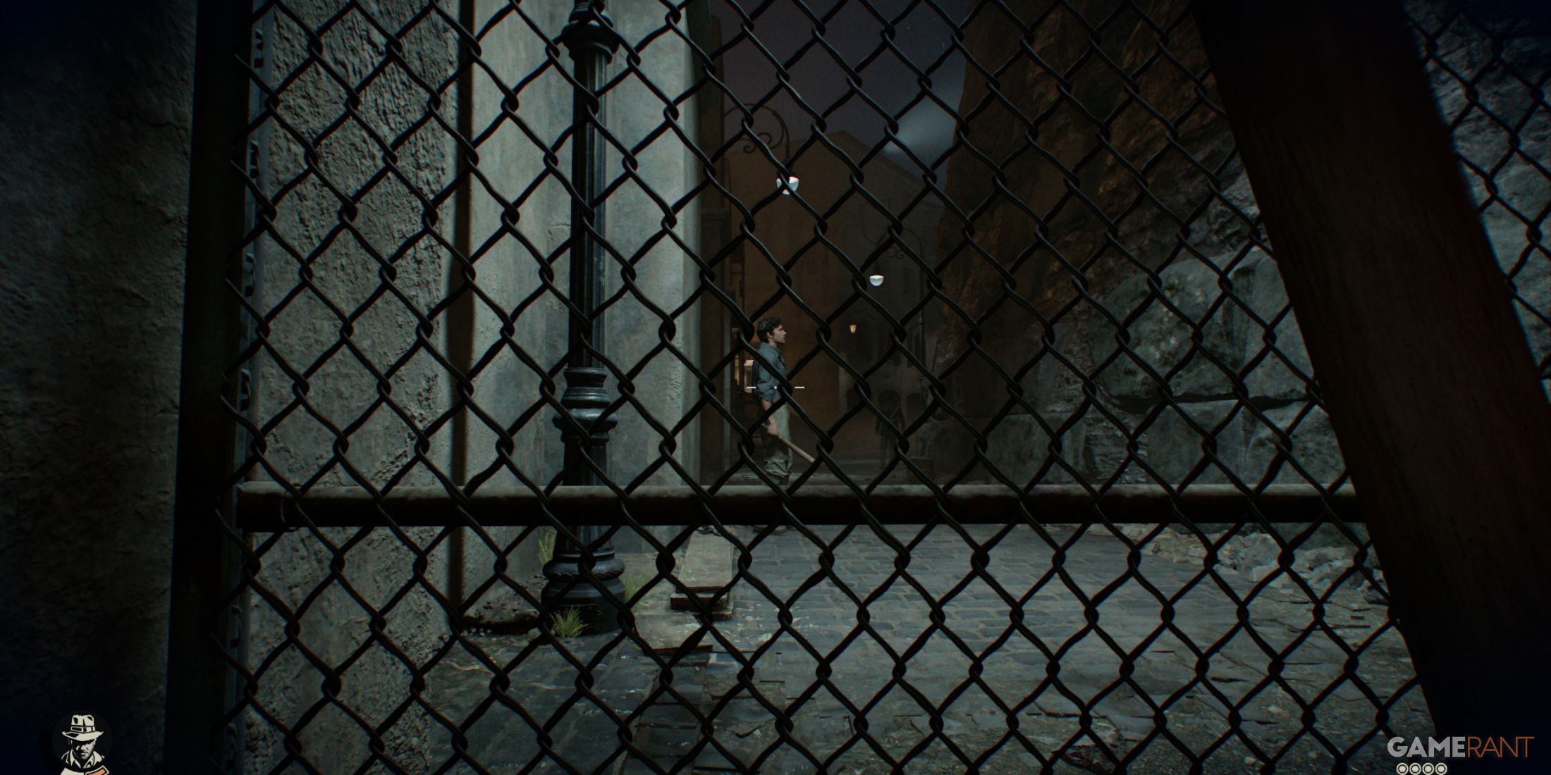 A character seen through a fence in a dimly lit alley, emphasizing stealth in Indiana Jones and The Great Circle