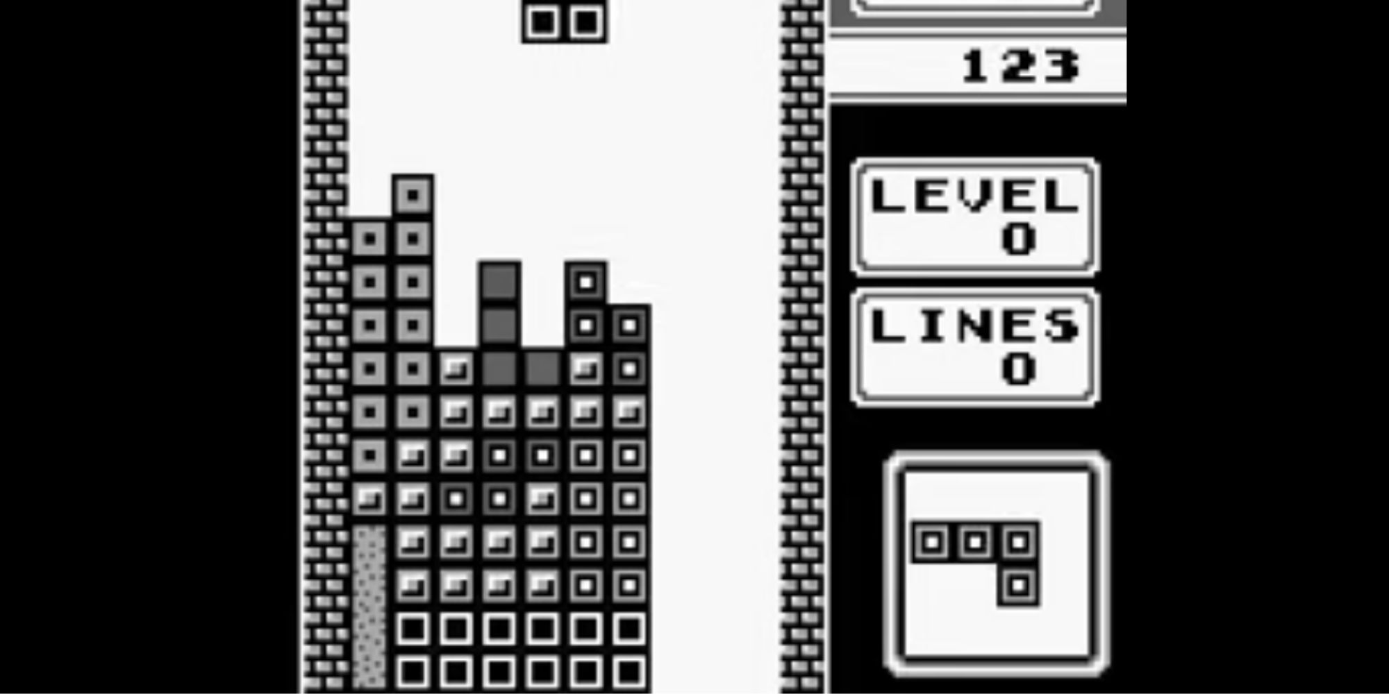 A stack of Tetris bricks build-up on the left side of the board in Tetris.